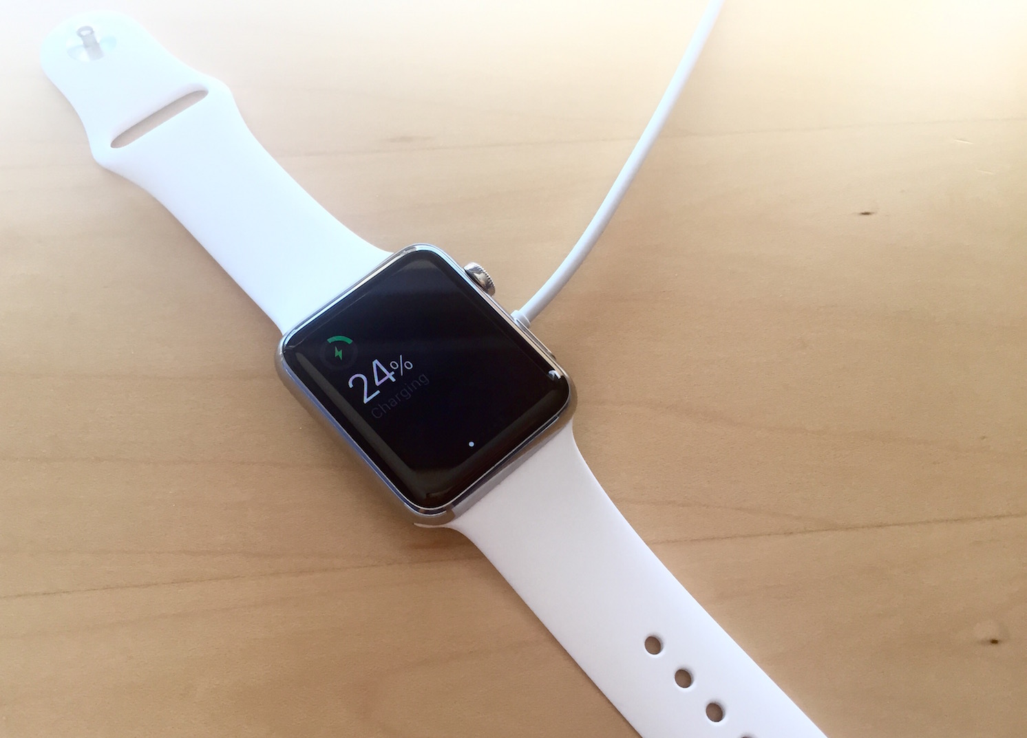 Apple Watch charging on desk