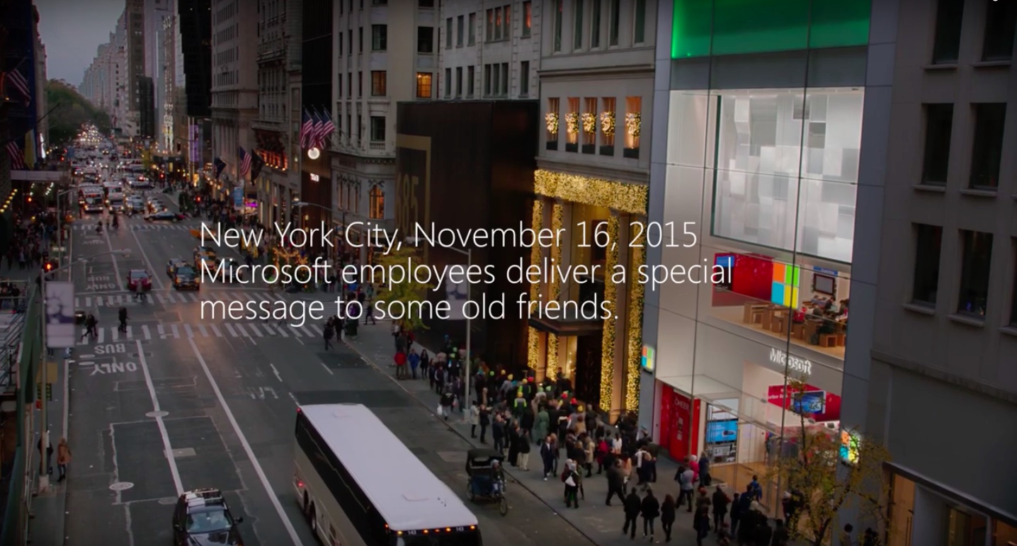 photo of Microsoft Store employees make a peace offering to their Apple Store peers in holiday video image