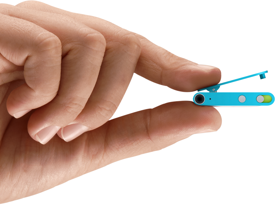 Marketing image showing a hand holding an iPod shuffle by its clip