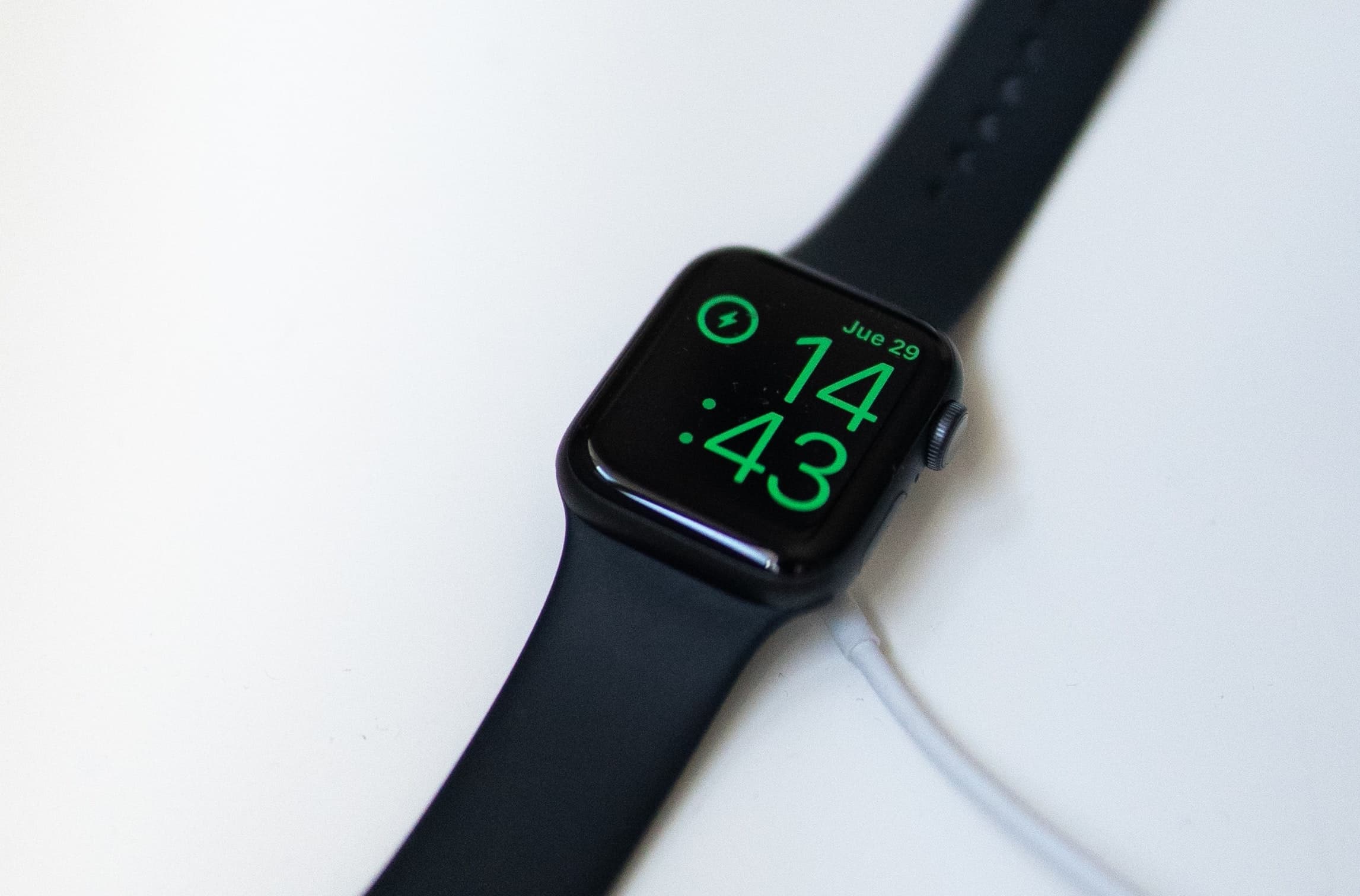 Apple Watch connected to its charger