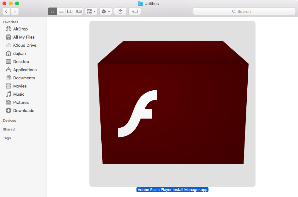 A Downloads window in the Finder showing the selected Adobe Flash Player uninstaller