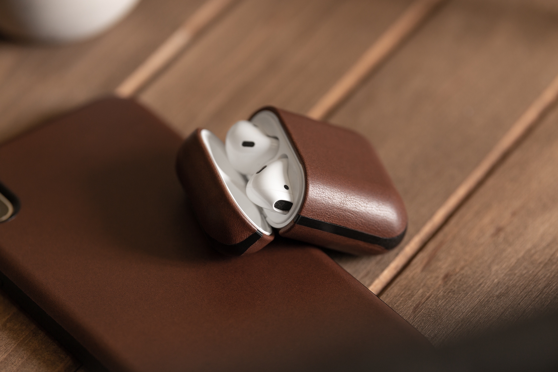 thumbnail interactive-video image 1 of Nomad Rustic Brown Genuine Leather AirPods Case (Version 2) - Wireless Charging Compatible, Rugged Design For 2nd Gen AirPods 1 of 2