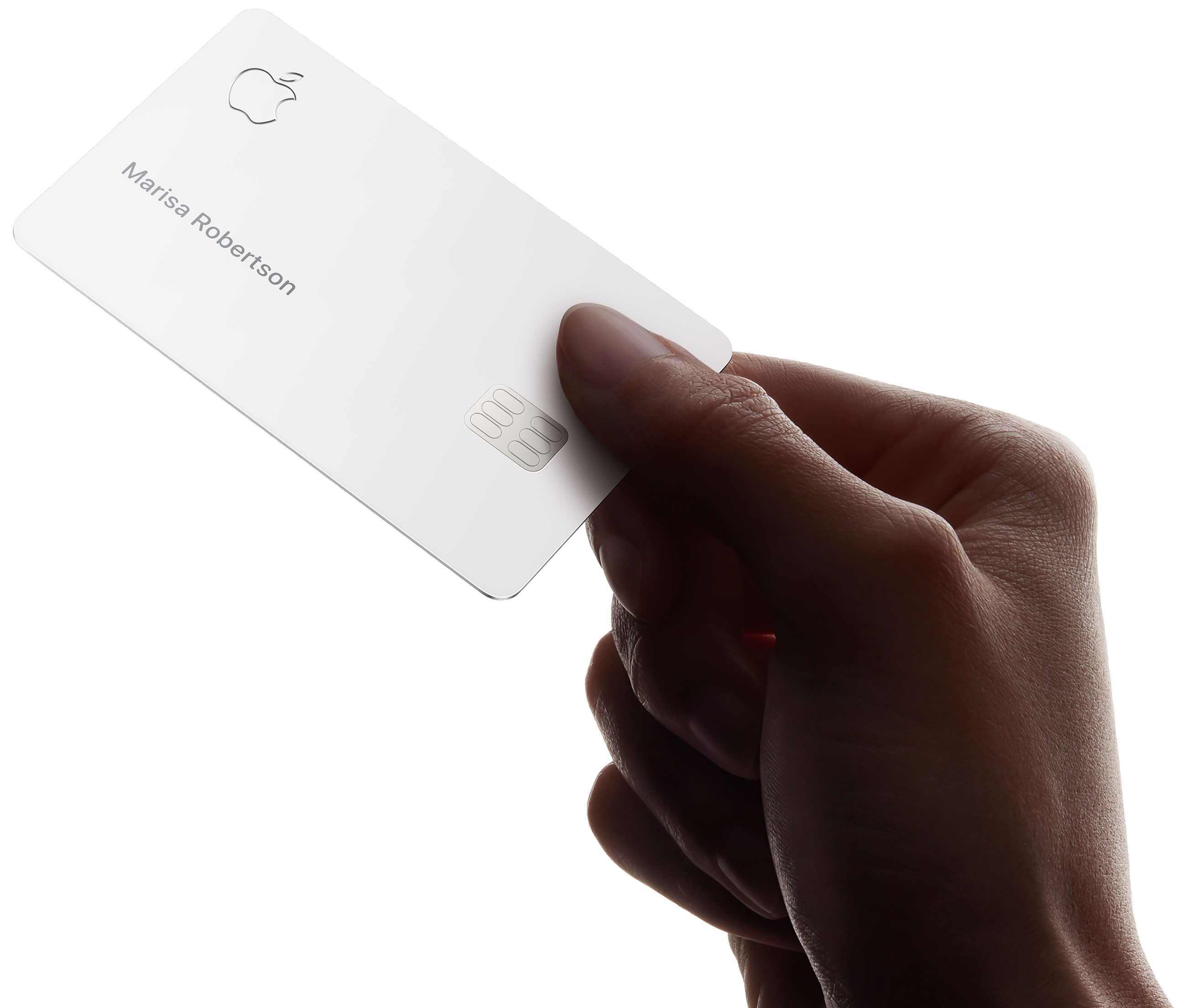 Person holding physical titanium Apple card