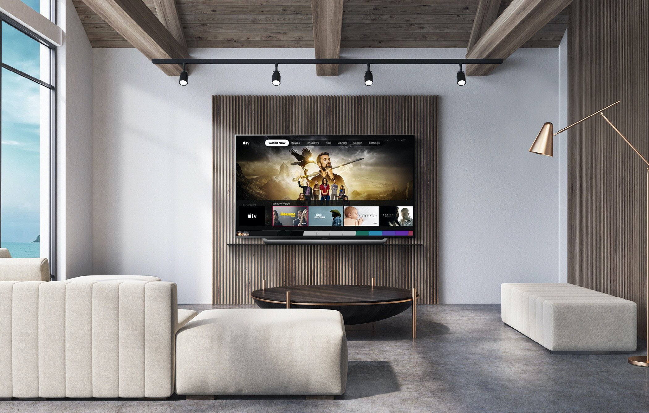 LG's marketing image showing its OLED TV Hund up on the wall, with Apple's TV app running