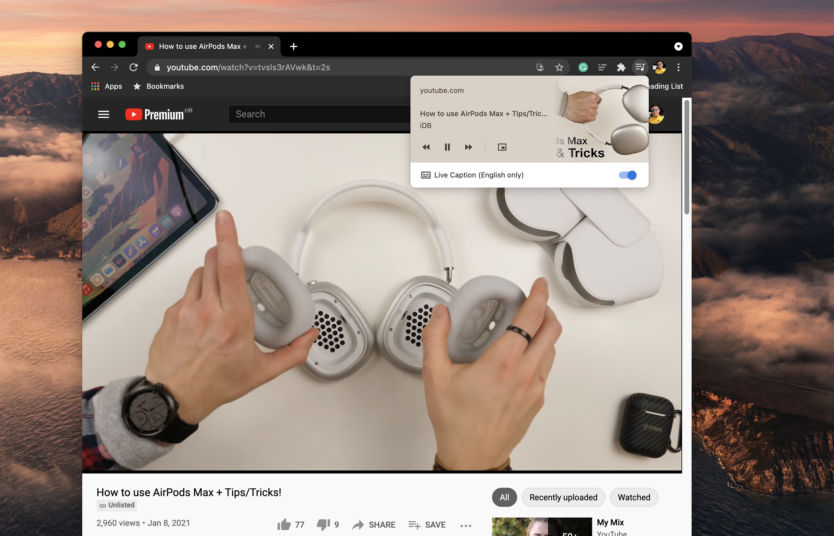 A macOS screenshot showing Google Chrome for Mac with the playback controls for a YouTube video along with the Live Caption toggle