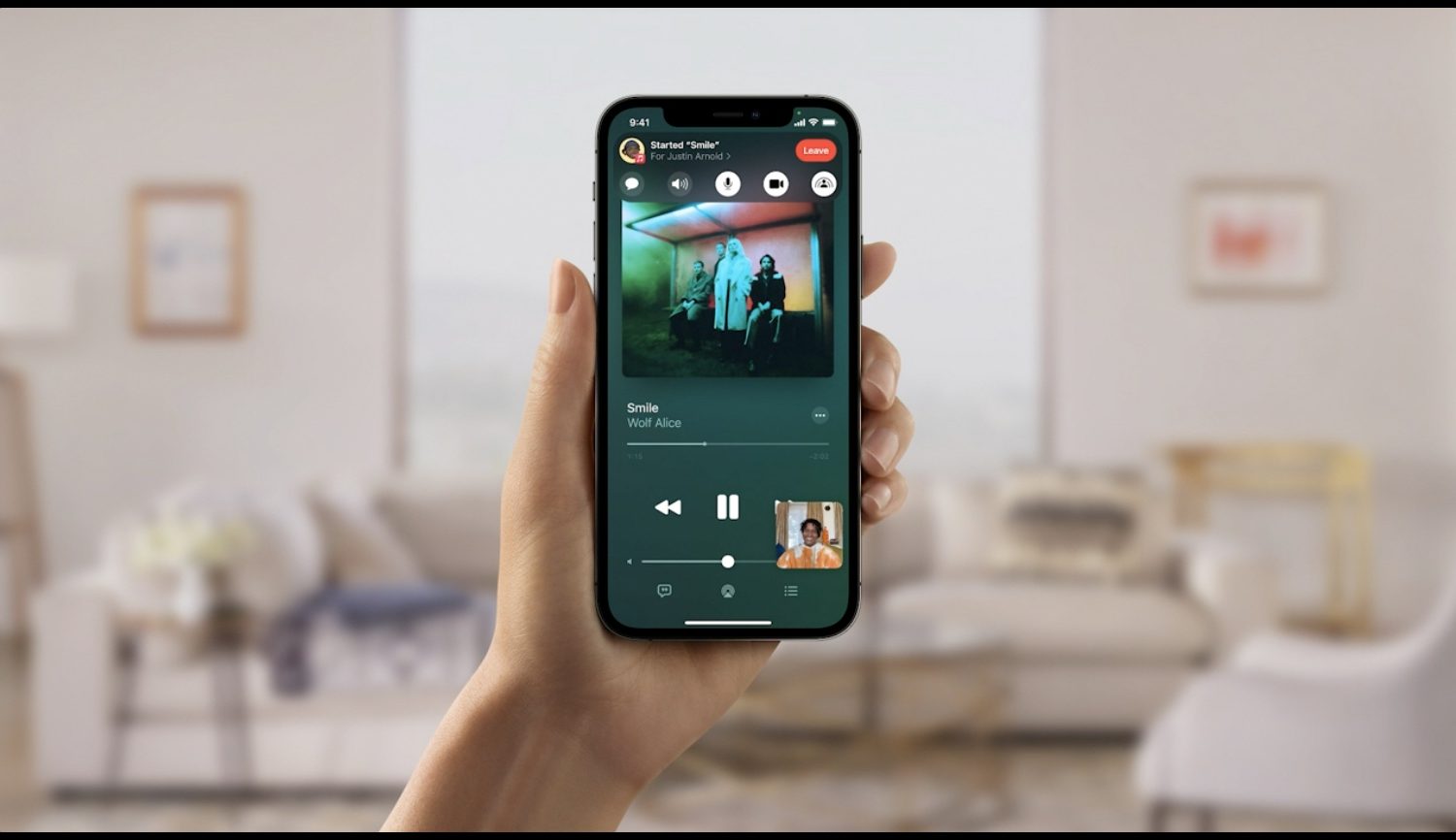 Apple's marketing image for SharePlay on iPhone showing shared media playing during FaceTime video call