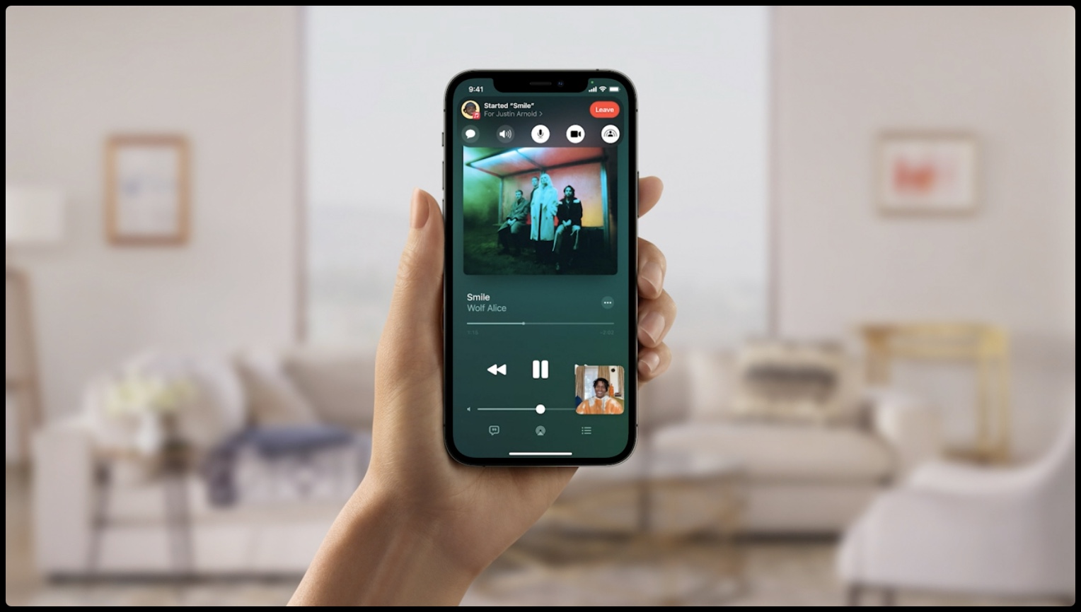 Apple's marketing image for SharePlay on iPhone showing shared media playing during FaceTime video call