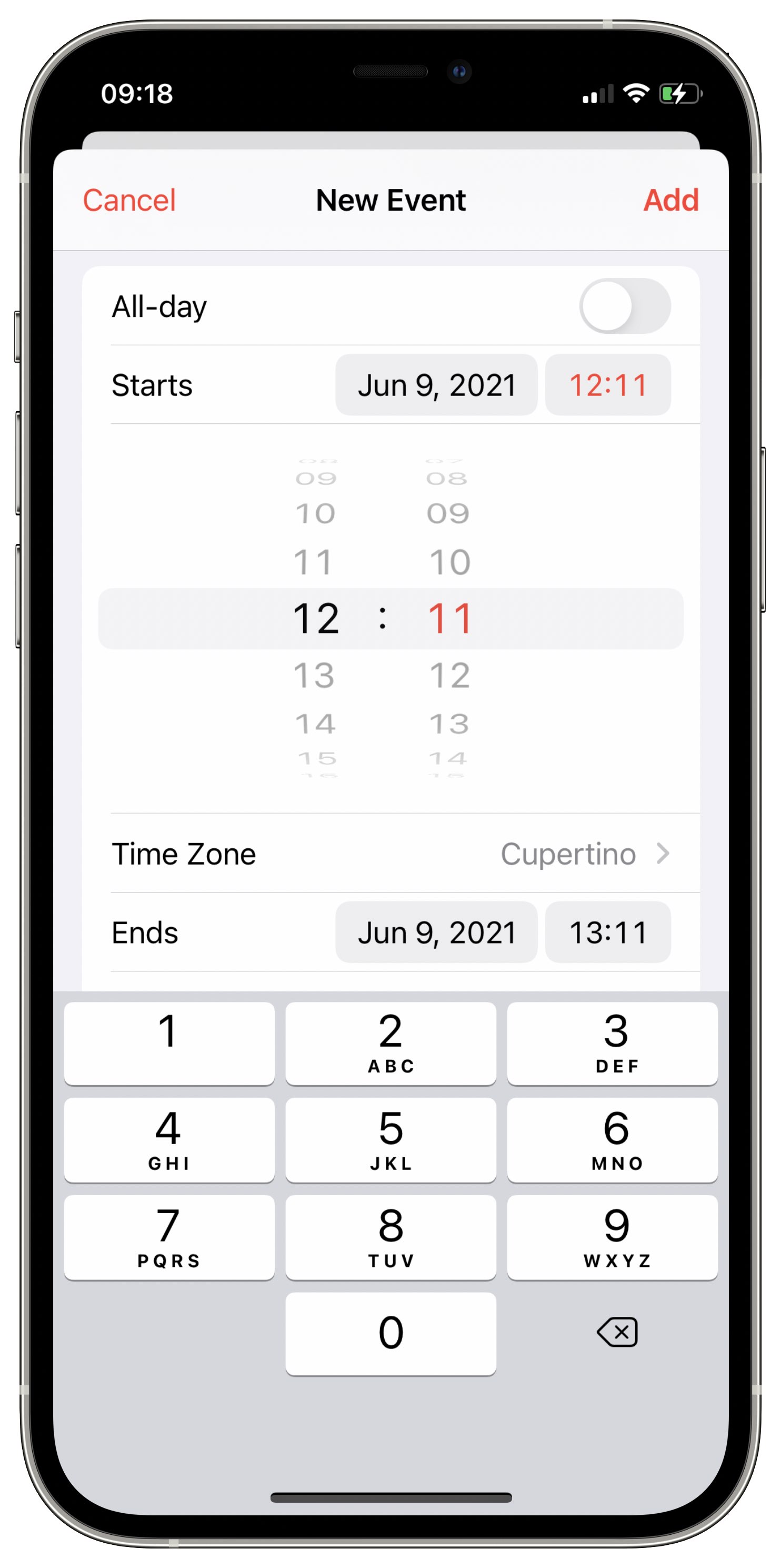 iPhone screenshot showing the wheel-based time dial picker selector for Apple Reminders on iOS 15