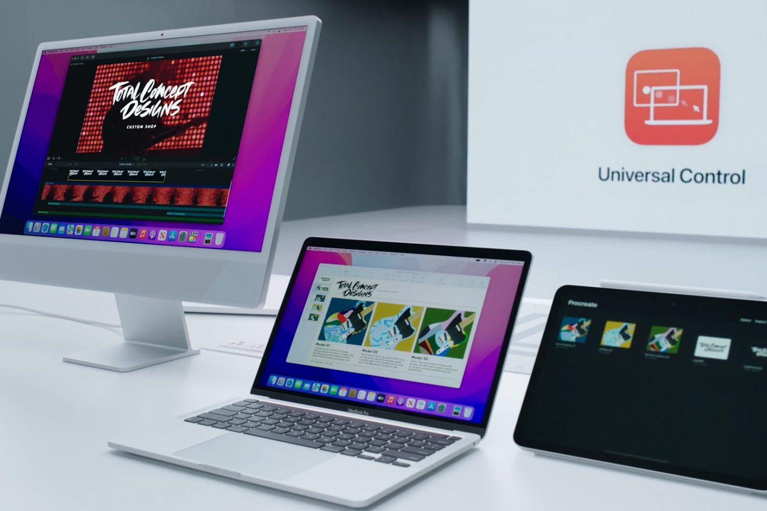 Apple's marketing image showing an iMac, MacBook Pro and iPad next to each other on a work desk, controlled wirelessly with the Universal Control feature