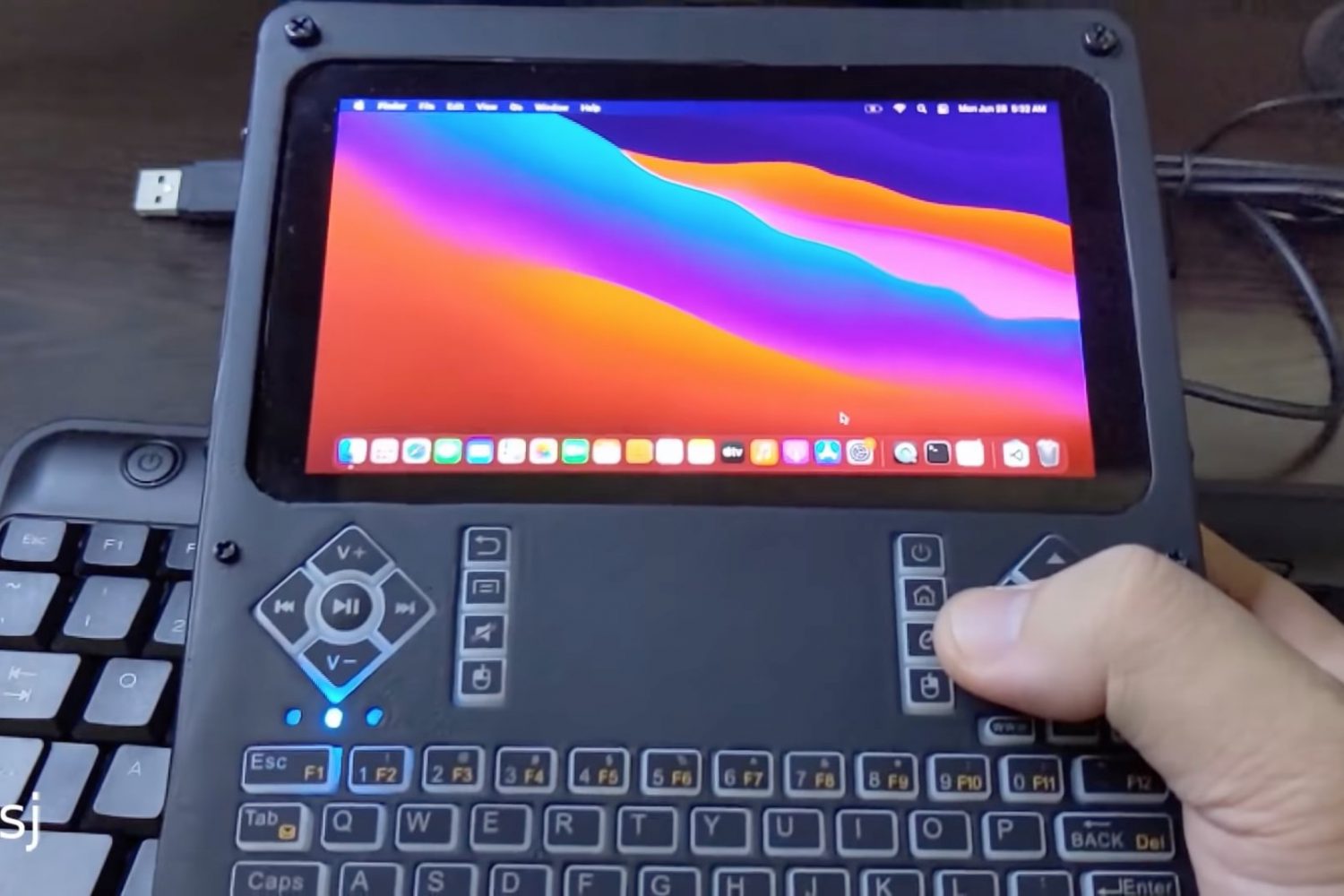 A still from a YouTube video showing a DIY handheld computer running Apple's macOS Big Sur software