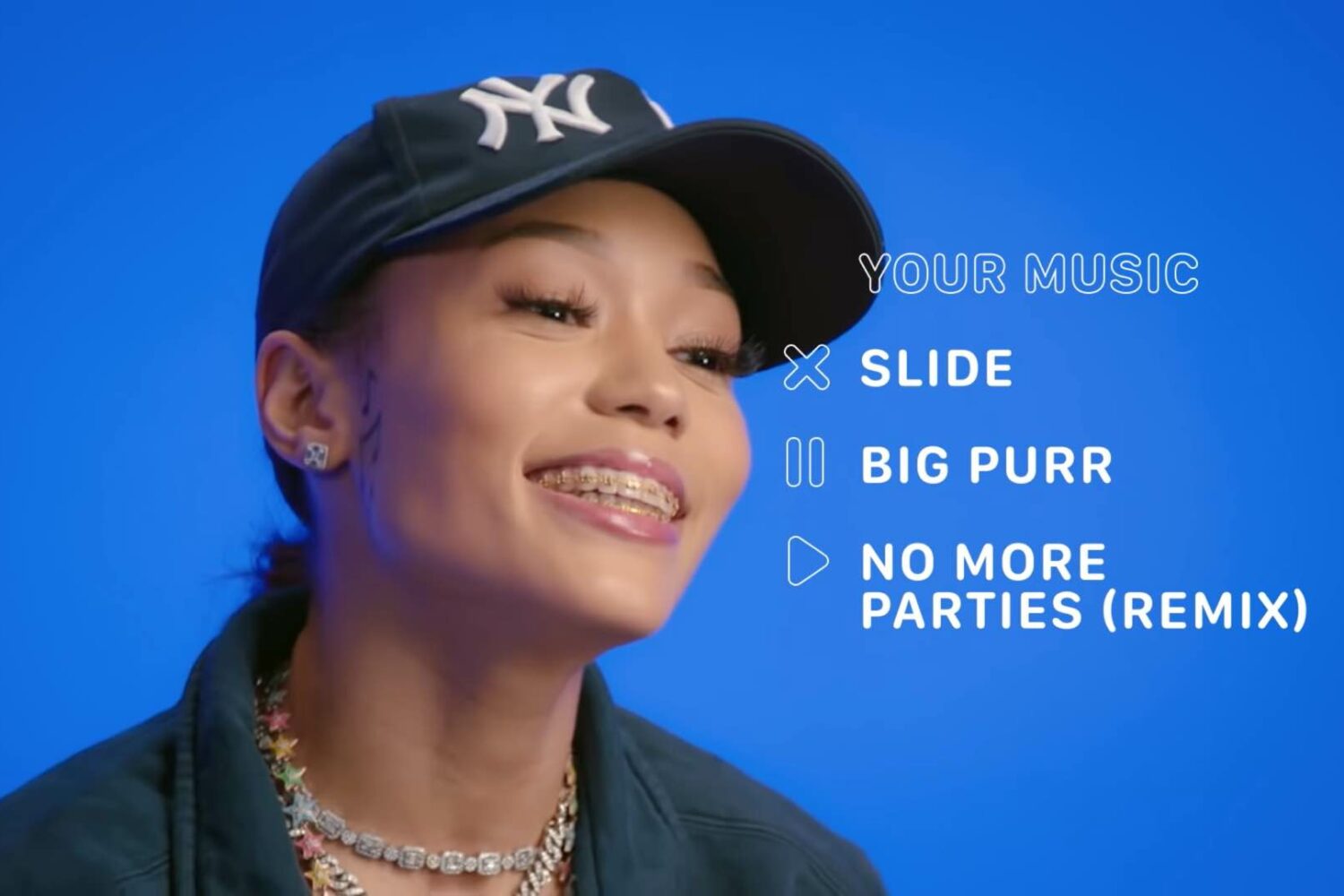 A still from Apple's game show "Play, Pause, Delete" featuring rapper Coi Leray