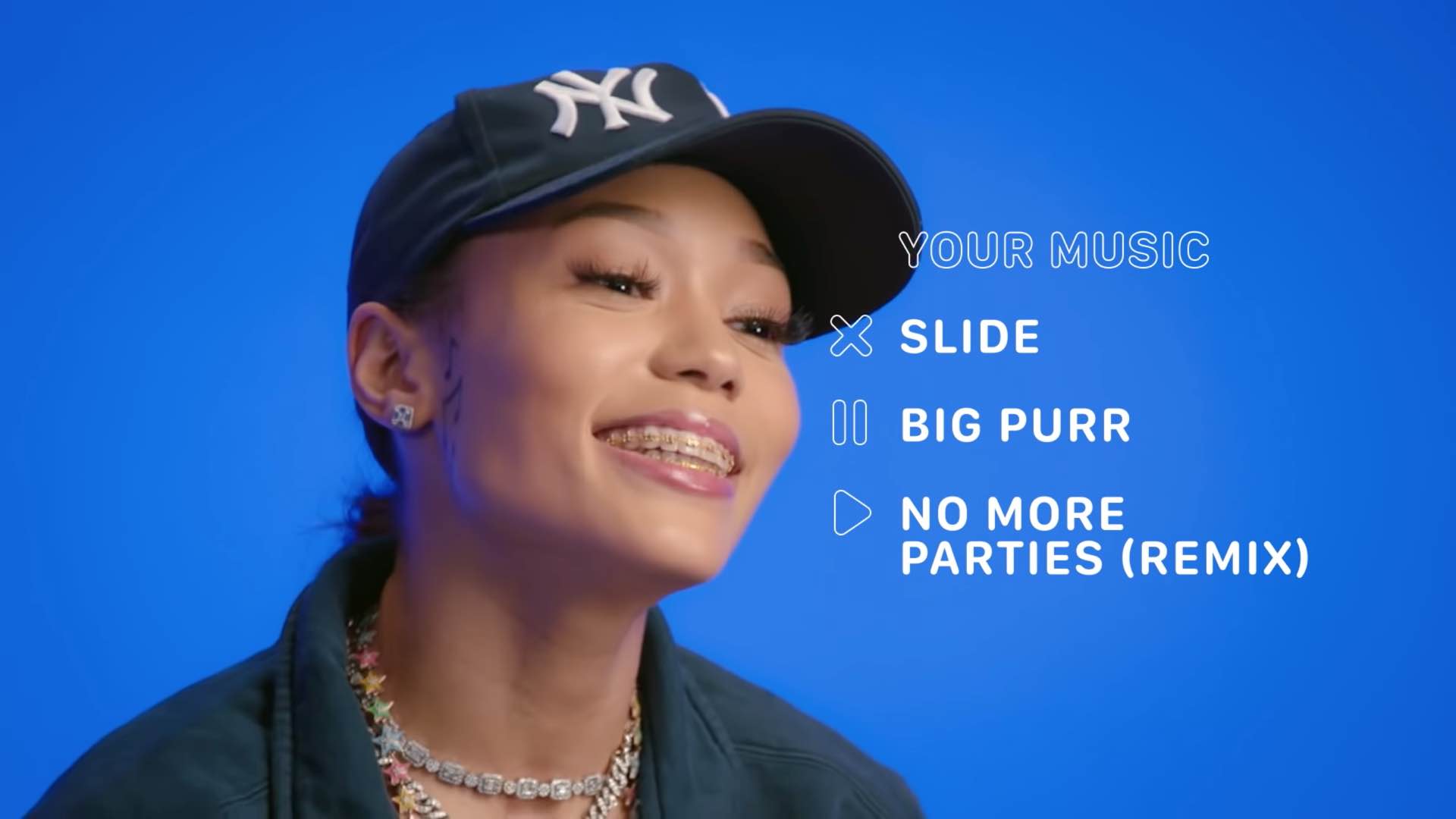 A still from Apple's game show "Play, Pause, Delete" featuring rapper Coi Leray