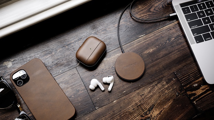 A lifestyle photo depicting Journey's MagSafe-compatible wireless charger swathed in luxurious leather
