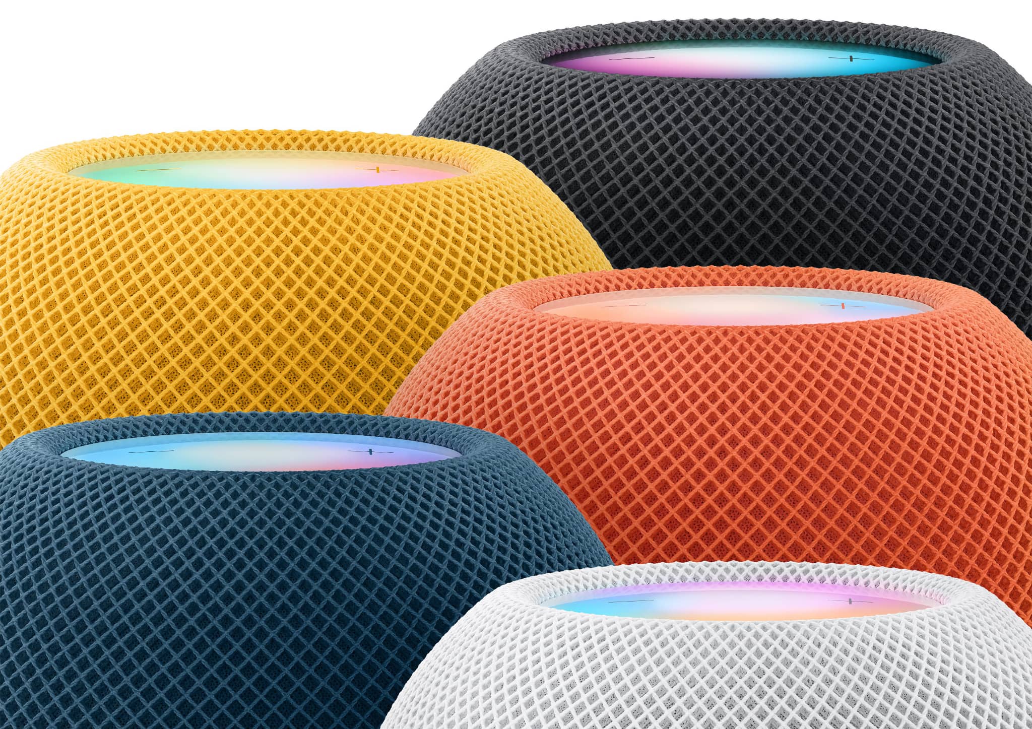 Apple's marketing image showing the upper half of the HomePod mini speakers in black, white, blue, orange and yellow