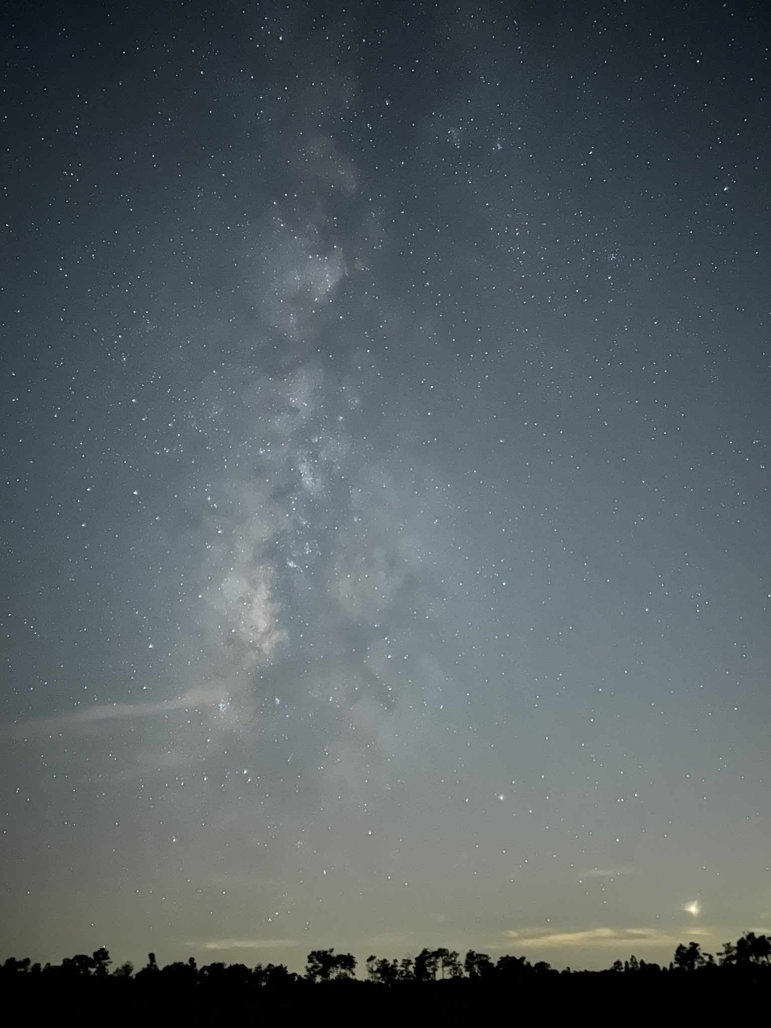 An image showing a 30-second exposure of the Milky Way taken with the iPhone 13 Pro Max camera in Apple's ProRaw format 