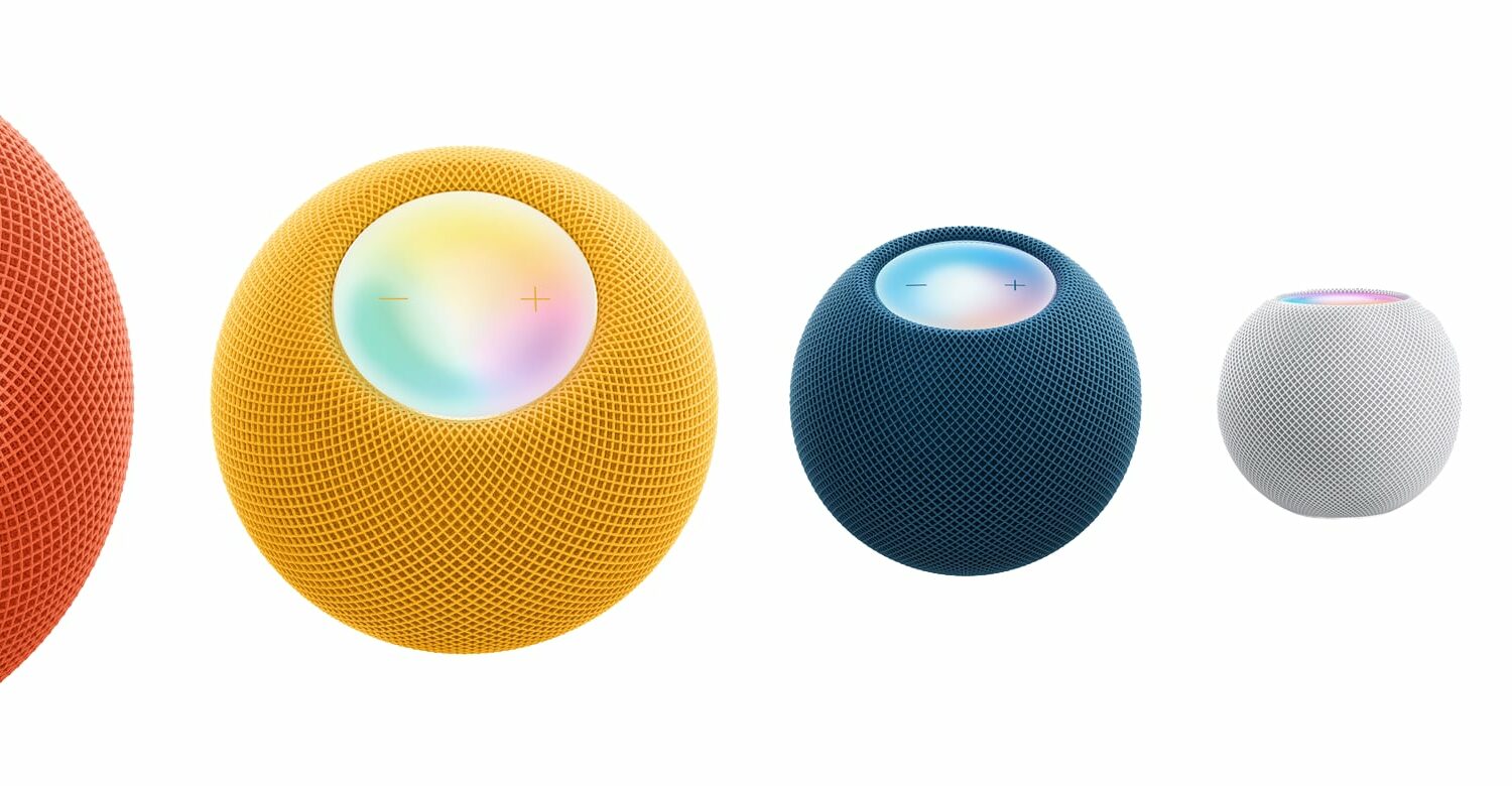 Apple's marketing image showing HomePod mini smart speakers in orange, yellow, blue, silver and black