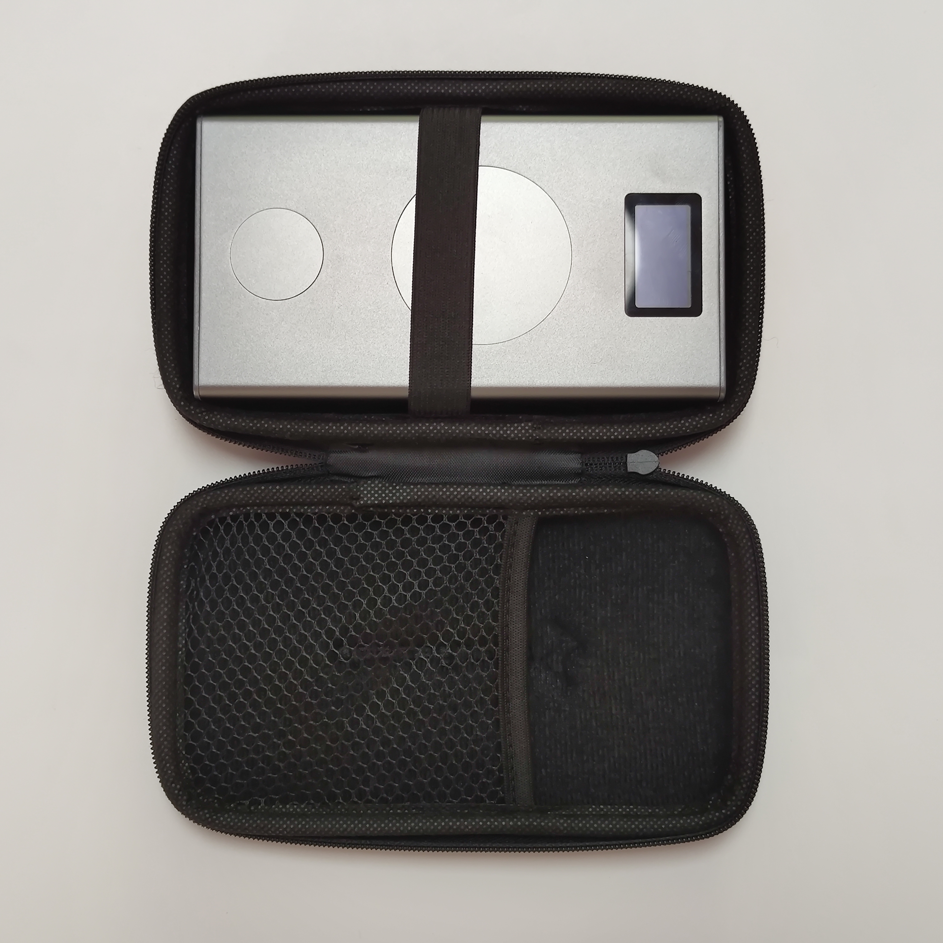 A photograph showing a top-down view of Chargeasap's Flash Pro Plus portable power bank in its hard carrying case