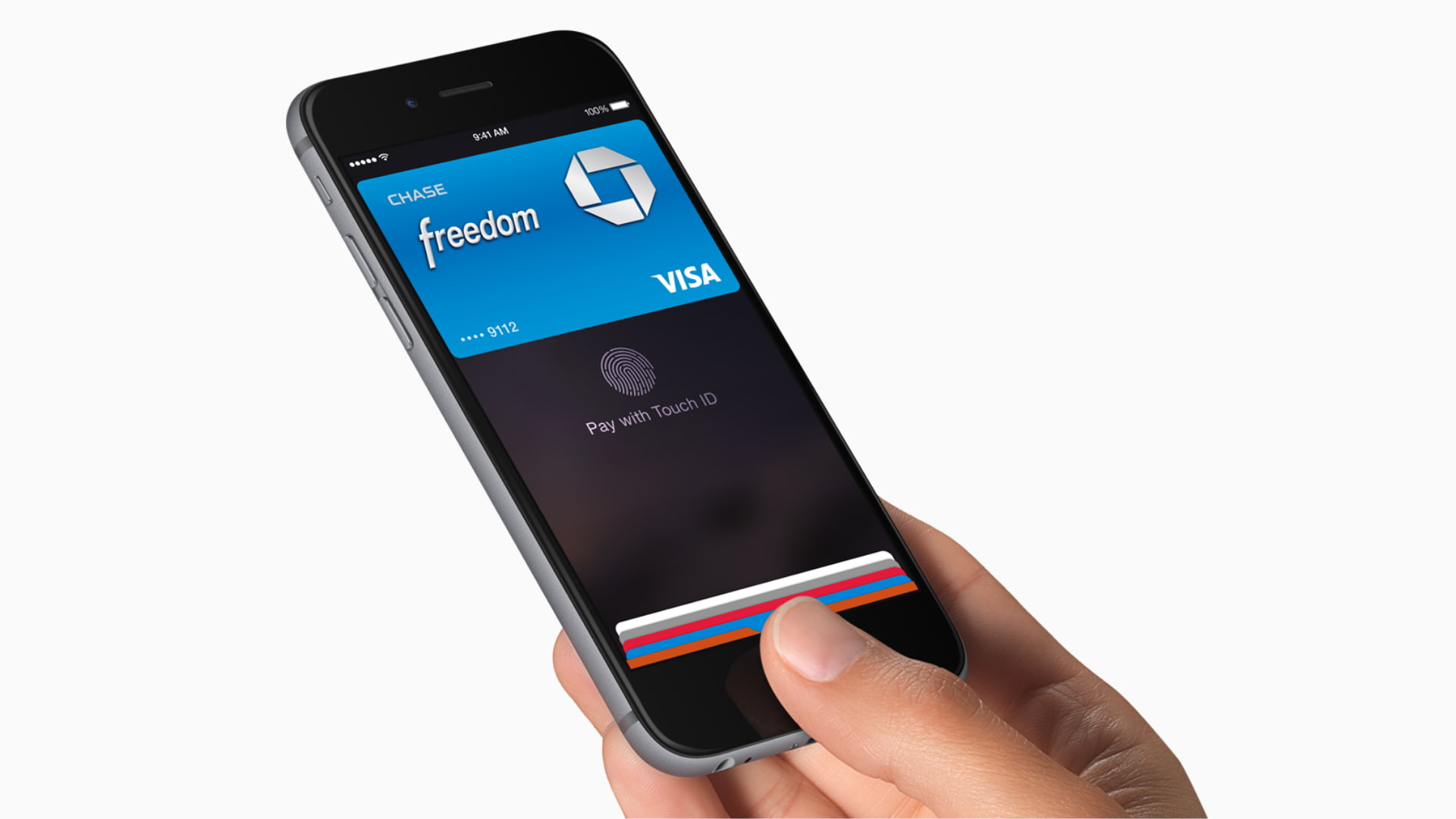 Hand holding an iPhone with Apple Pay screen showing added payment cards