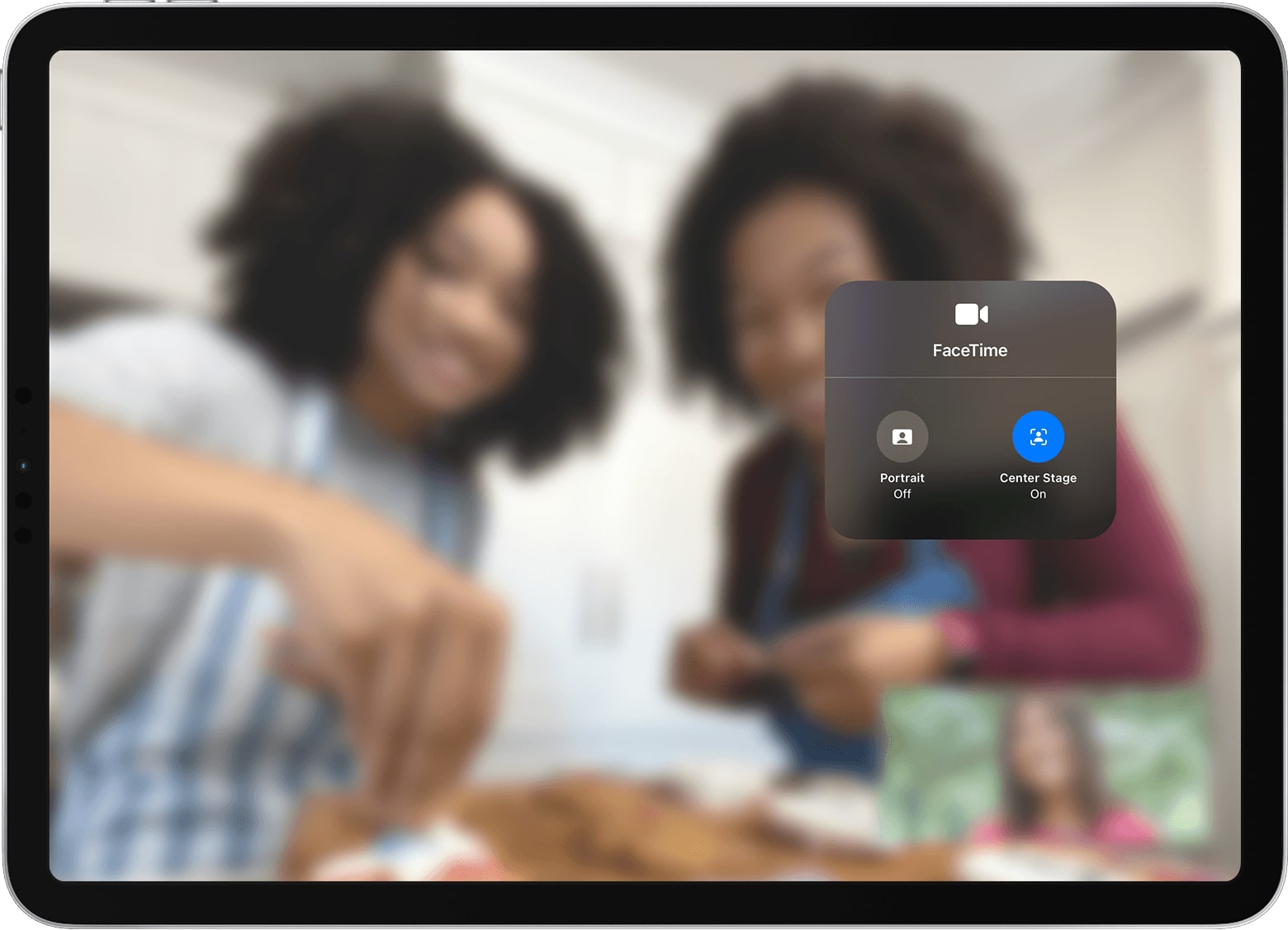 Apple's marketing image showing the iOS 15 Control Center overlay on iPad Pro with the Center Stage camera feature selected in the Video Effects menu, and a blurred FaceTime video call in the background 