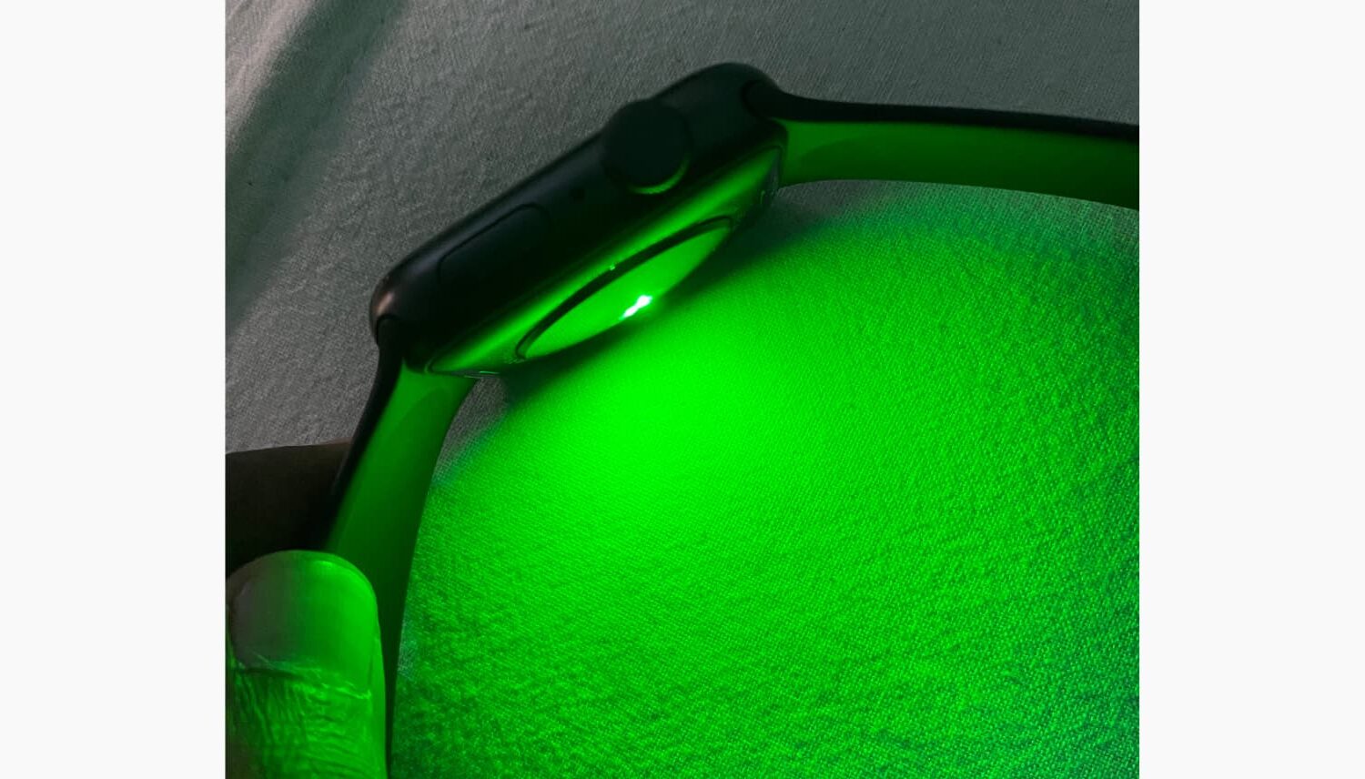 Green Light shining from back of the Apple Watch