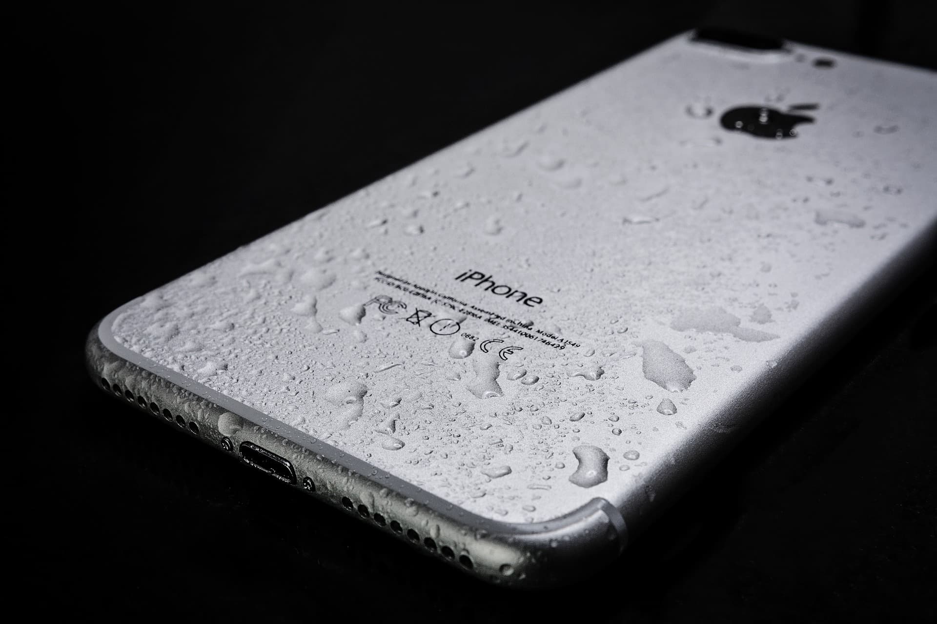 Wet iPhone with water droplets