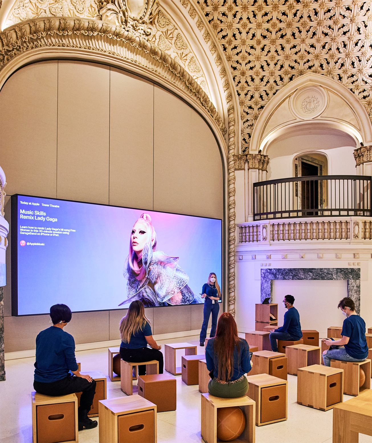 A photograph showing people in an Apple store participating in the new Today at Apple remixing sessions in GarageBand featuring Lady GaGa music