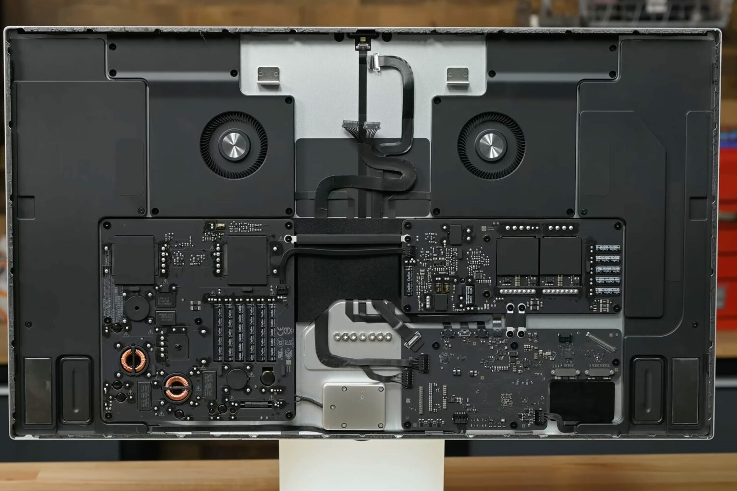 A still from iFixit's teardown video showing the internals of the 27-inch Apple Studio Display with its 5K Retina LCD panel removed