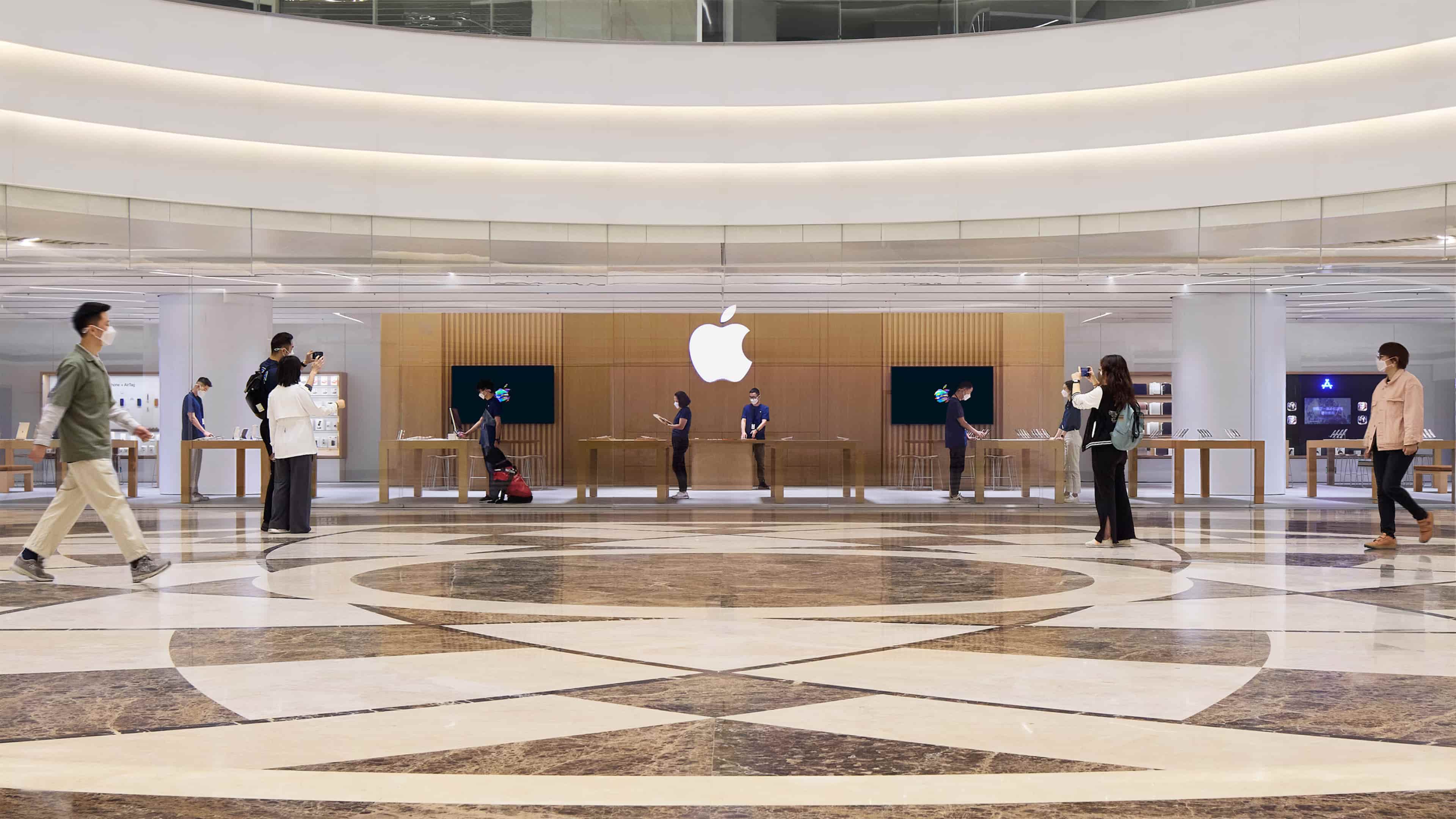 The interior of Apple Wuhan, the company's first store in China's Hubei Province and its 54th retail location in Greater China, is shown in this press photo from Apple, featuring granite floors and wood walls which make the interior brighter and transparent