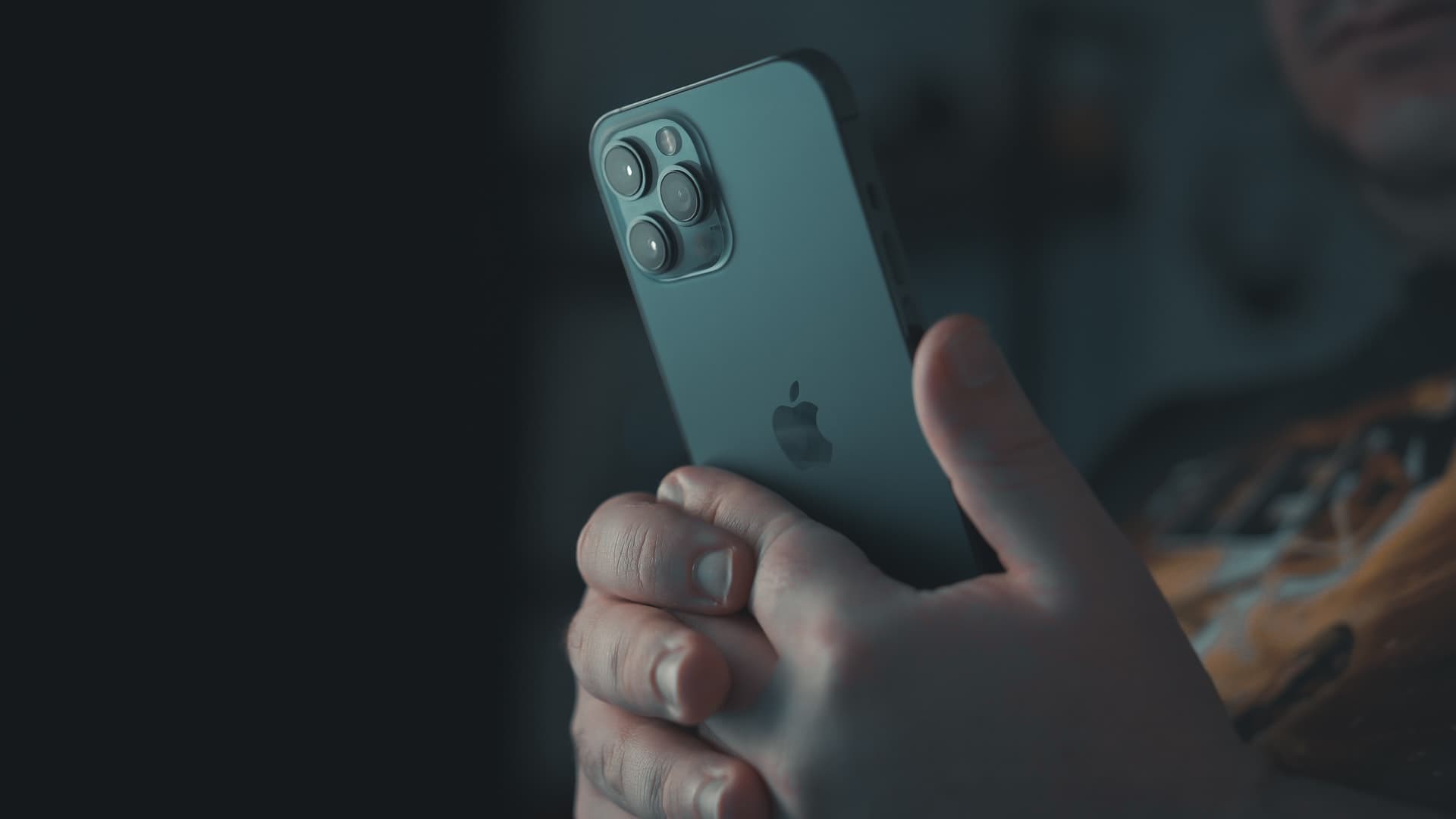 Holding iPhone in hands to show as if the person is recording a video