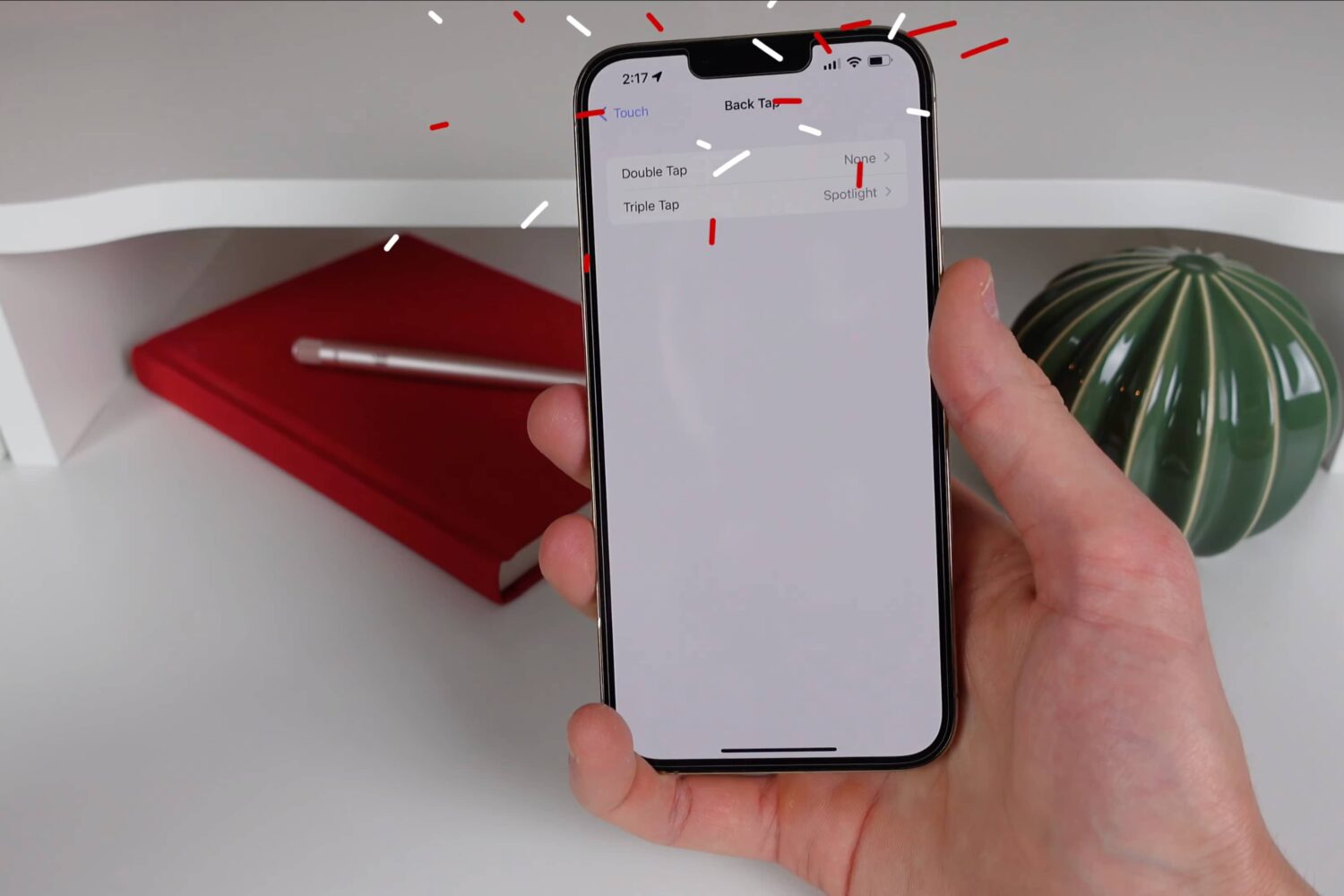 A still from iDownloadBlog's iPhone tips video showcasing Apple's Back Tap feature in action