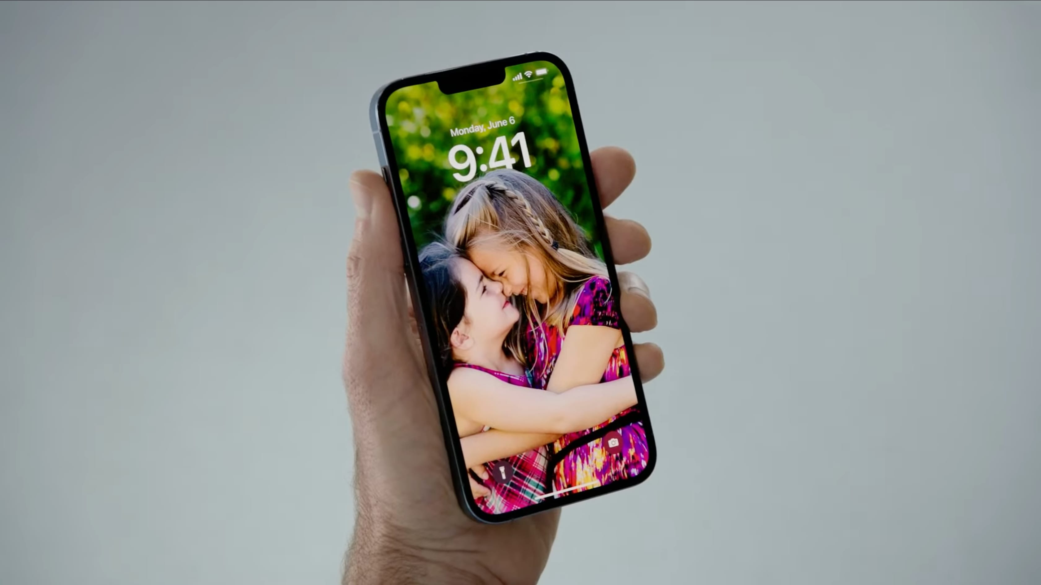 Customizing iOS 16's iPhone lock screen using the Photo theme is showcased in this still image grabbed from Apple's WWDC 2022 keynote video