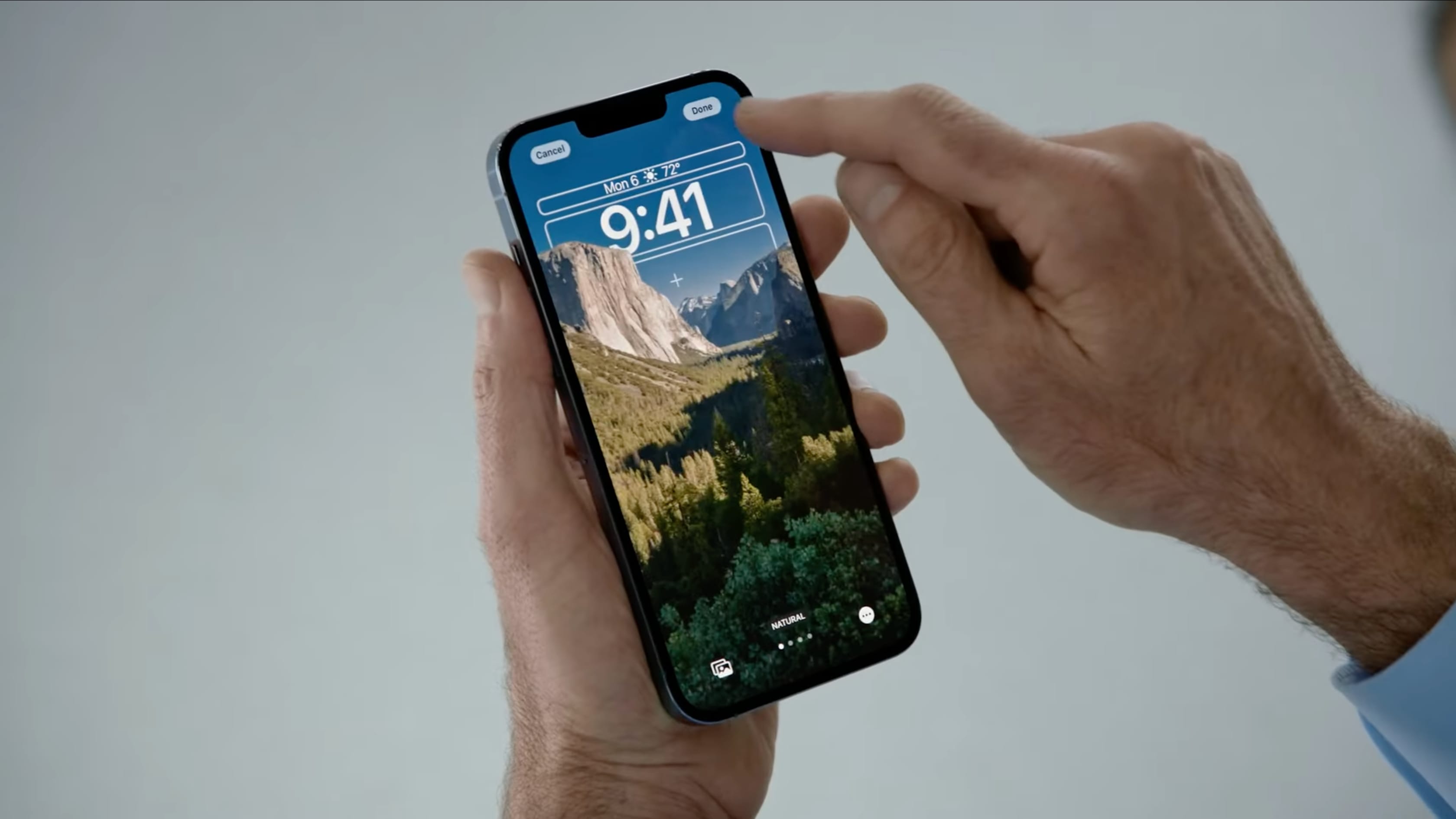 Customizing iOS 16's iPhone lock screen using the Natural theme is seen in this still image grabbed from Apple's WWDC 2022 keynote video