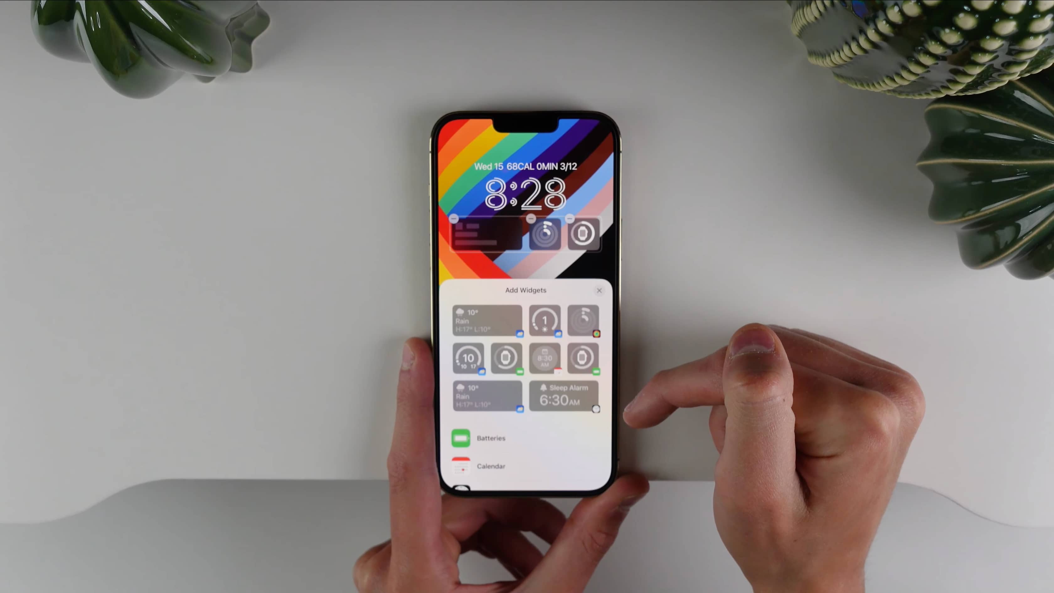 A still image from iDownloadBlog's video showcasing Apple's redesigned iPhone lock screen experience in iOS 16
