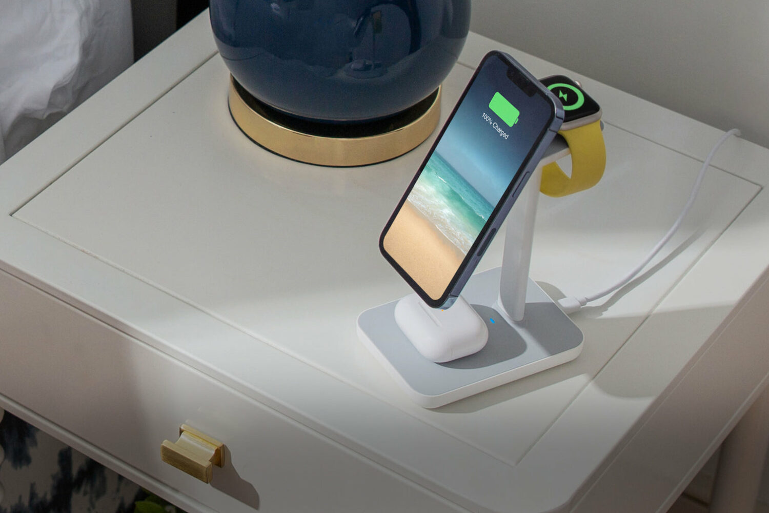Twelve South's multi-device HiRise 3 stand is charging a MagSafe iPhone, an Apple Watch and an AirPods Pro charging case simultaneously