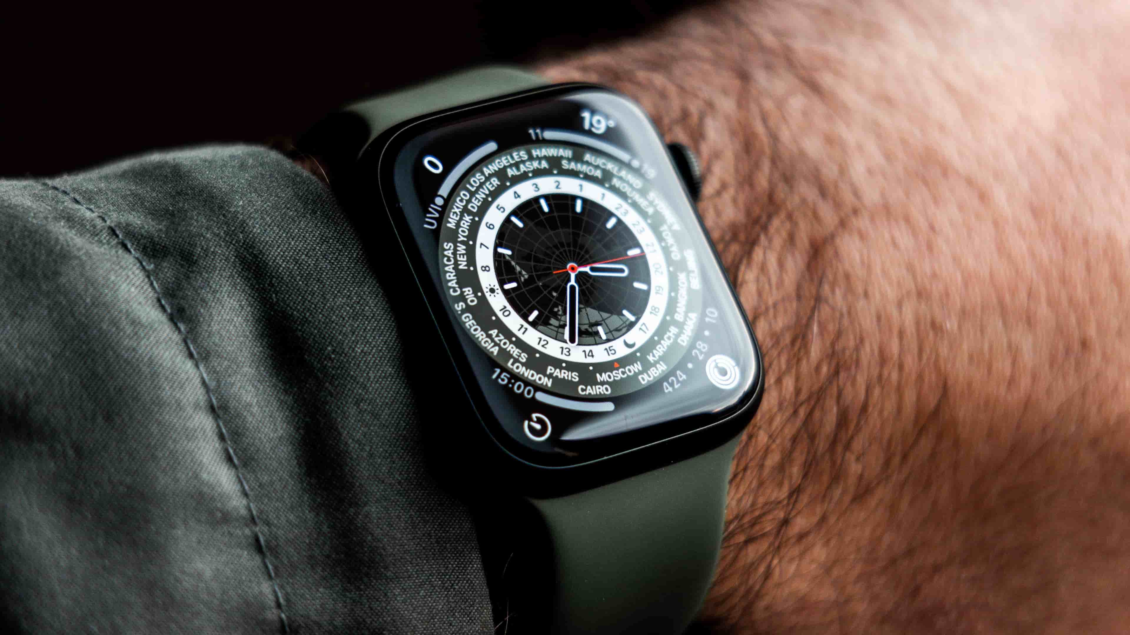A closeup of an Apple Watch Series 7 on a male wrist, with an Infograph watch face displayed on the screen