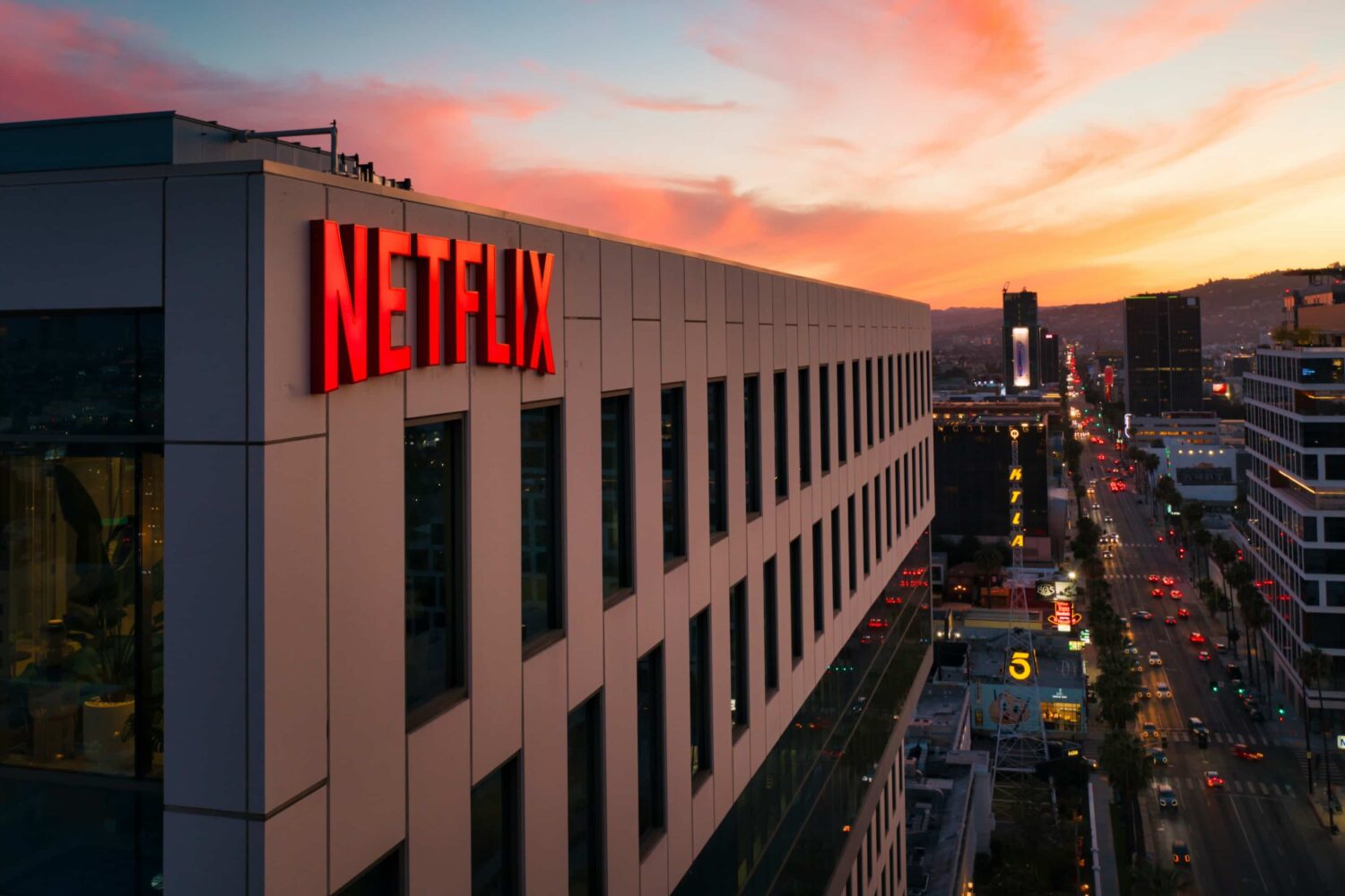 A Netflix logo sign on a building in Hollywood, Los Angeles at sunset