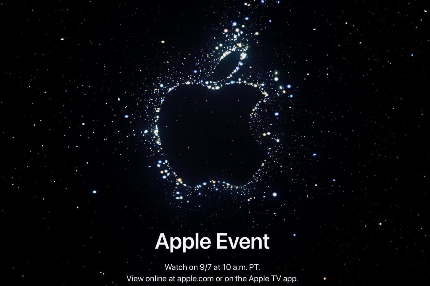 Apple invite for the September 2022 iPhone 14 event snows an Apple logo outline set against a galactic cluster background