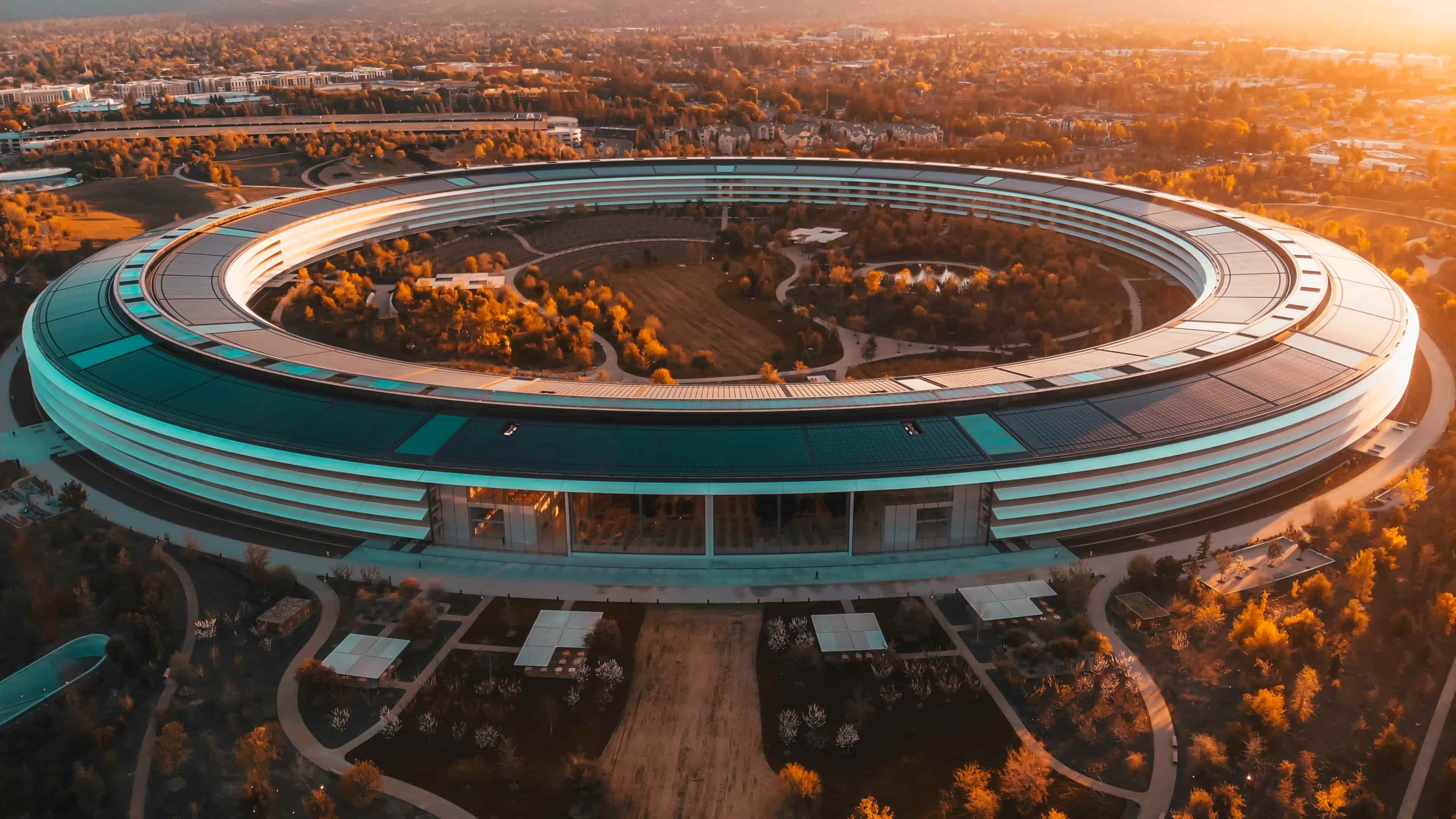 An aerial view of the Apple Park headquarters taken at sunset during the golden hour period