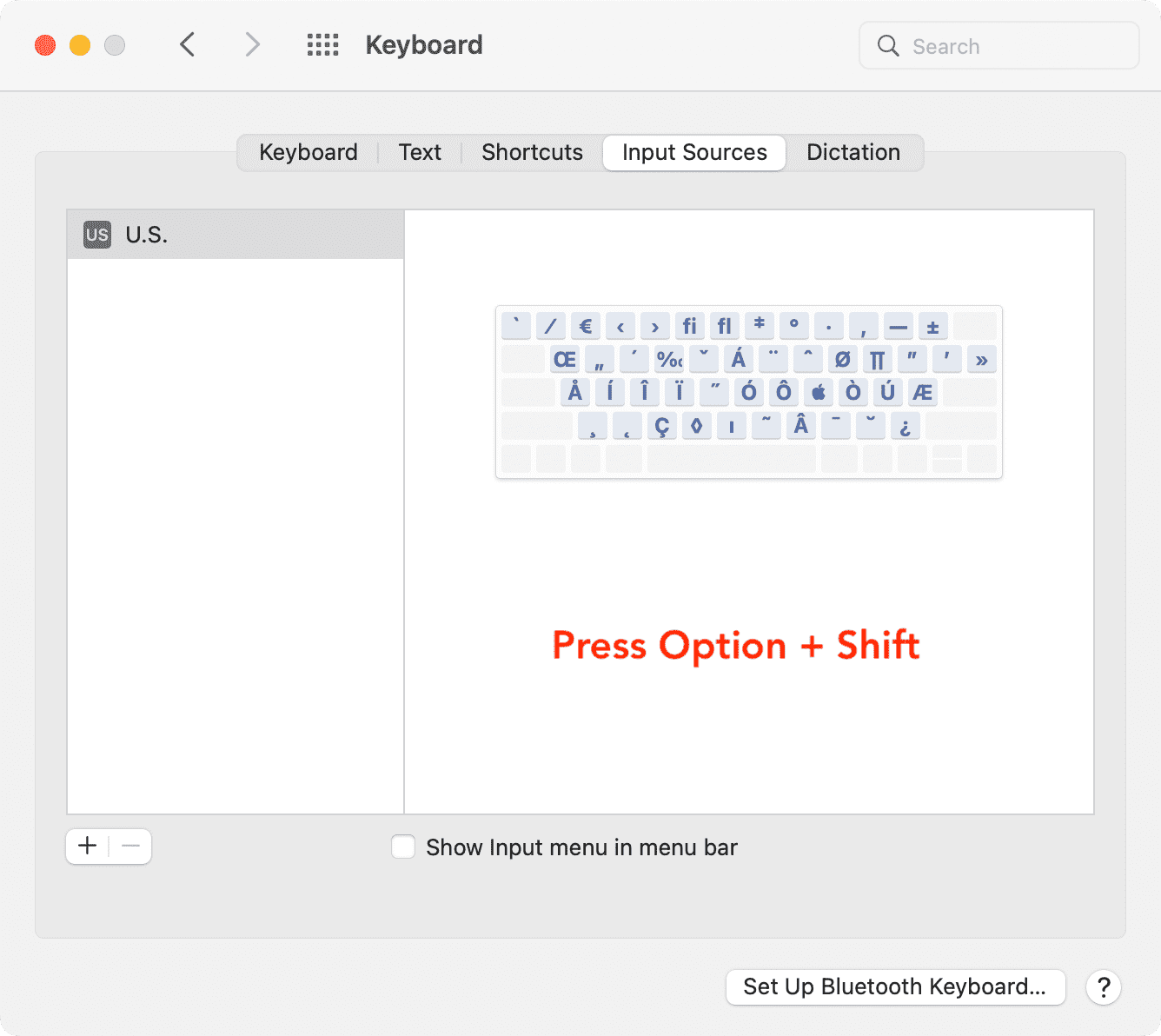 Presione Opción y Mayús en la configuración de Fuentes de entrada del teclado en Mac para ver más caracteres