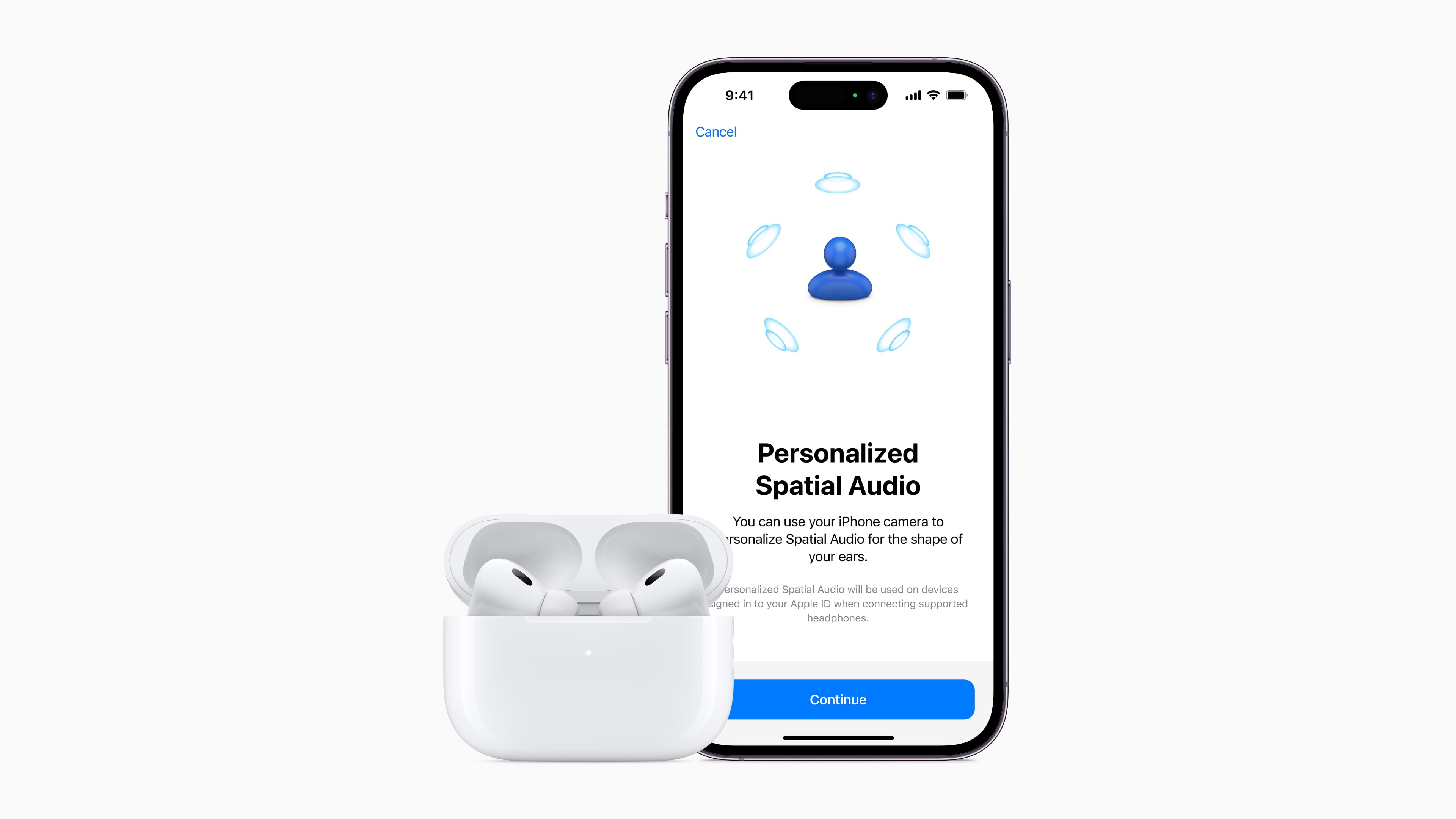 AirPods Pro next to iPhone displaying a splash screen for the personalized spatial audio feature