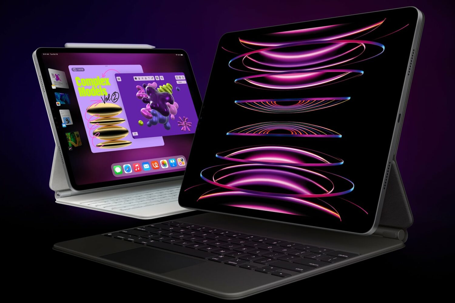 11-inch and 12.9-inch M2 iPad Pro with Apple's Magic Keyboard, set agains a dark background