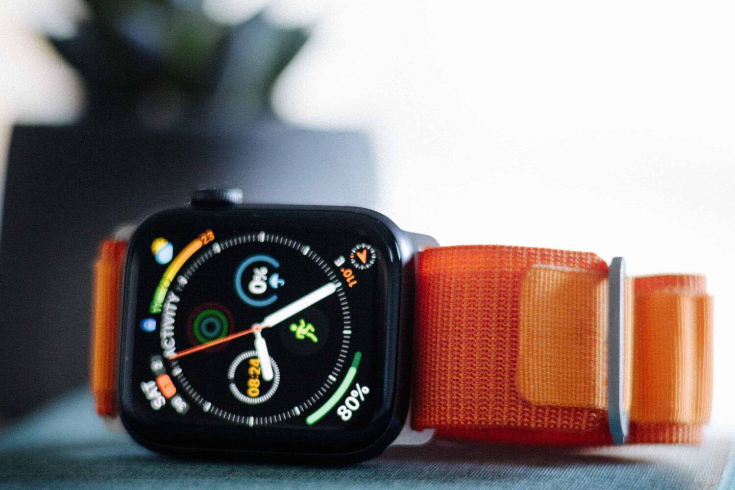 Apple Watch Ultra laid on a table on its side