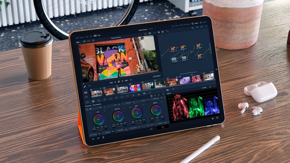 DaVinci Resolve running on an M2 iPad Pro sitting on a table alongside an Apple Pencil and a pair of AirPods Pro