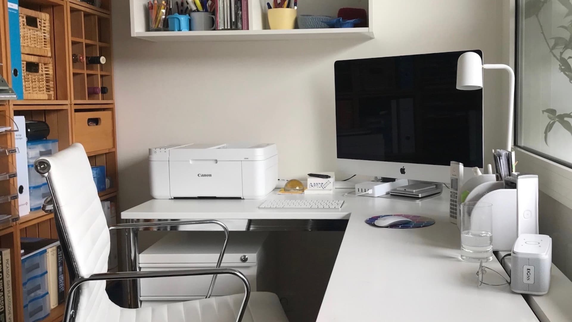 iMac and printer kept on a table