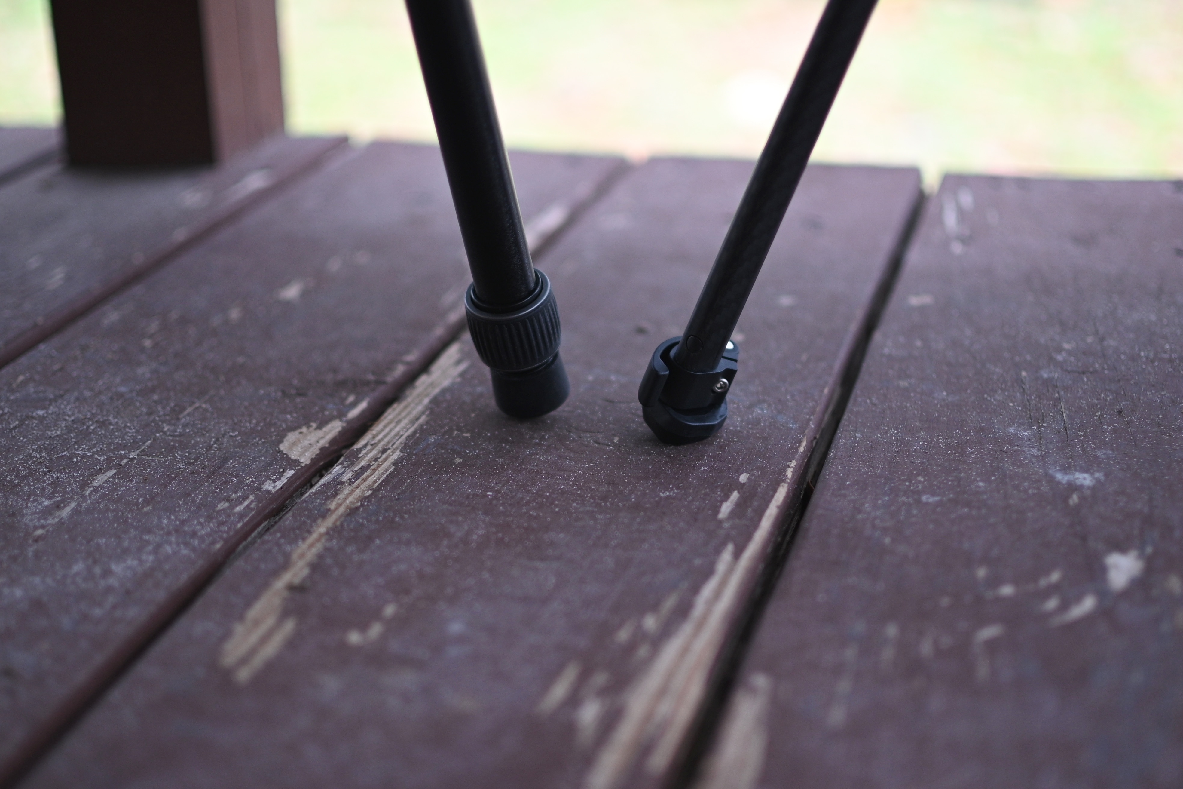Peak Design travel tripod feet (right) compared with ordinary tripod rounded feet (left).