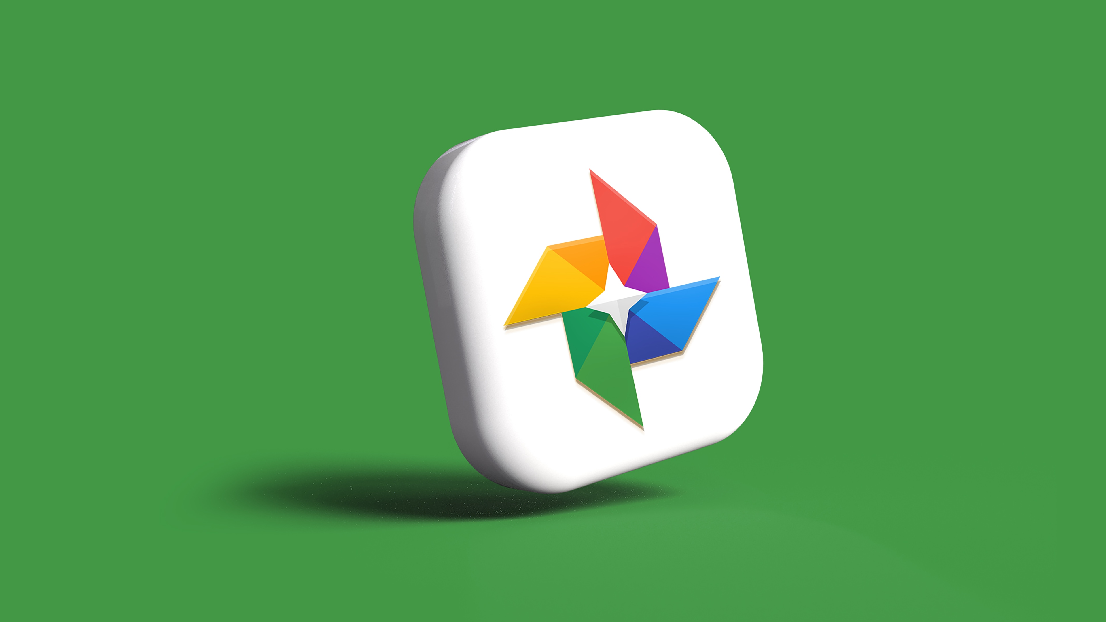 The Google Photos app icon in 3D, set against a green background