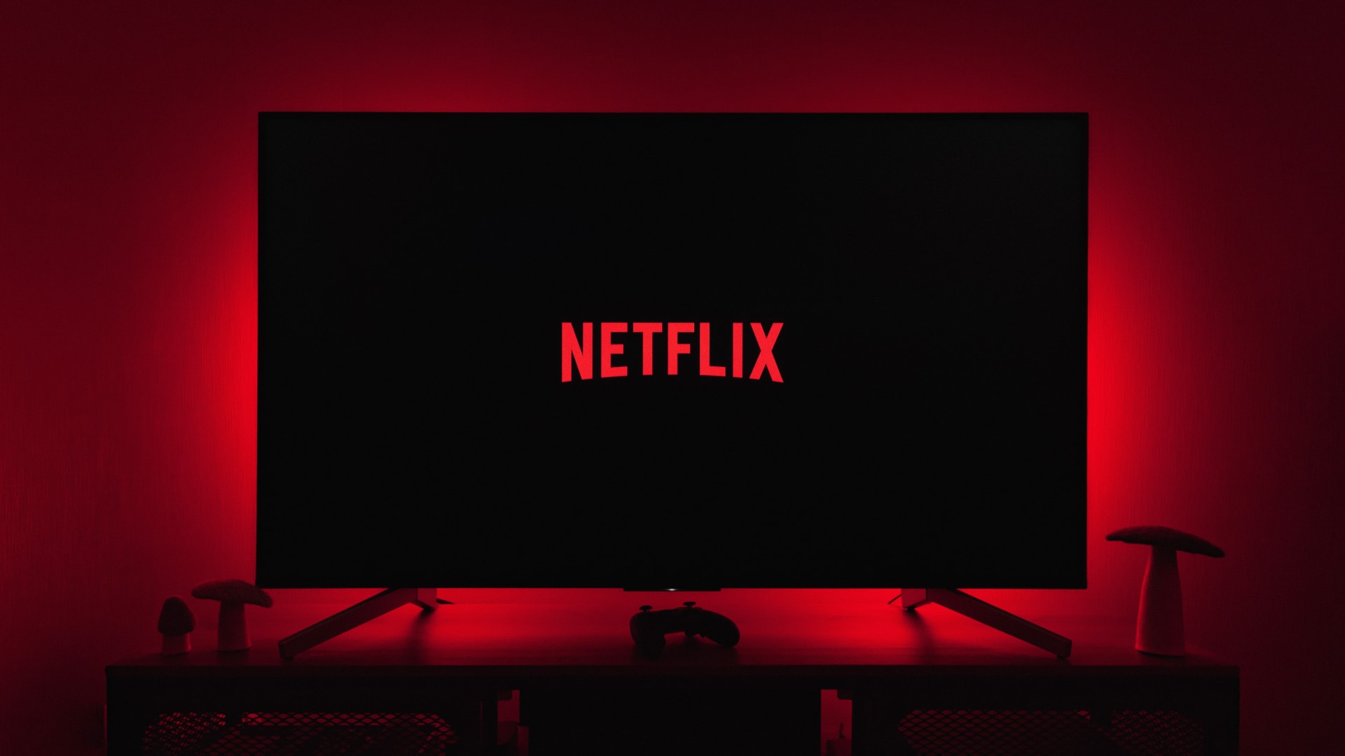 Netflix logo set against a black background, shown on a TV set