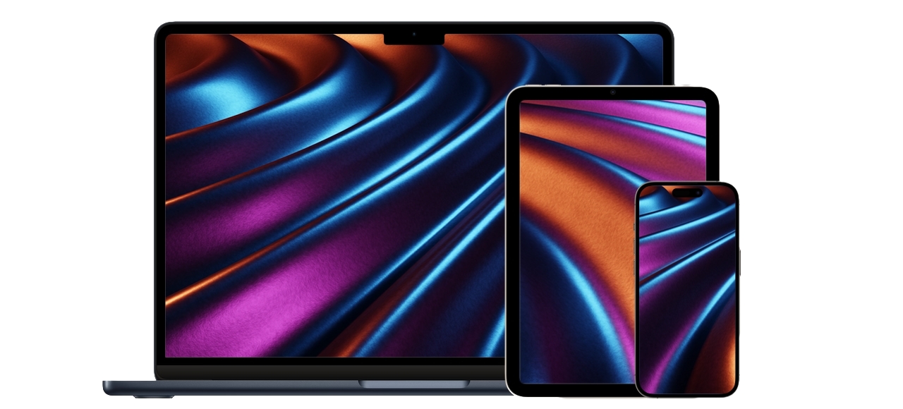 iPhone, iPad and Mac displaying a colorful abstract wallpaper