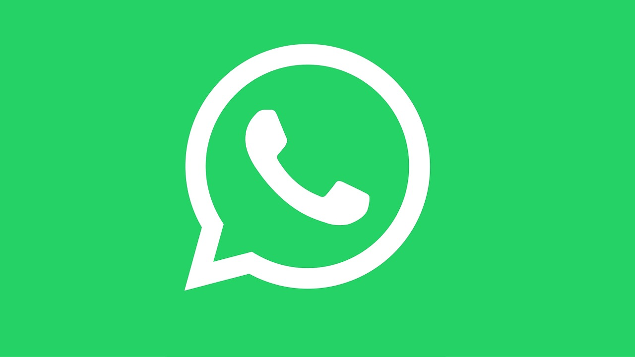 White WhatsApp logo set against a solid green background