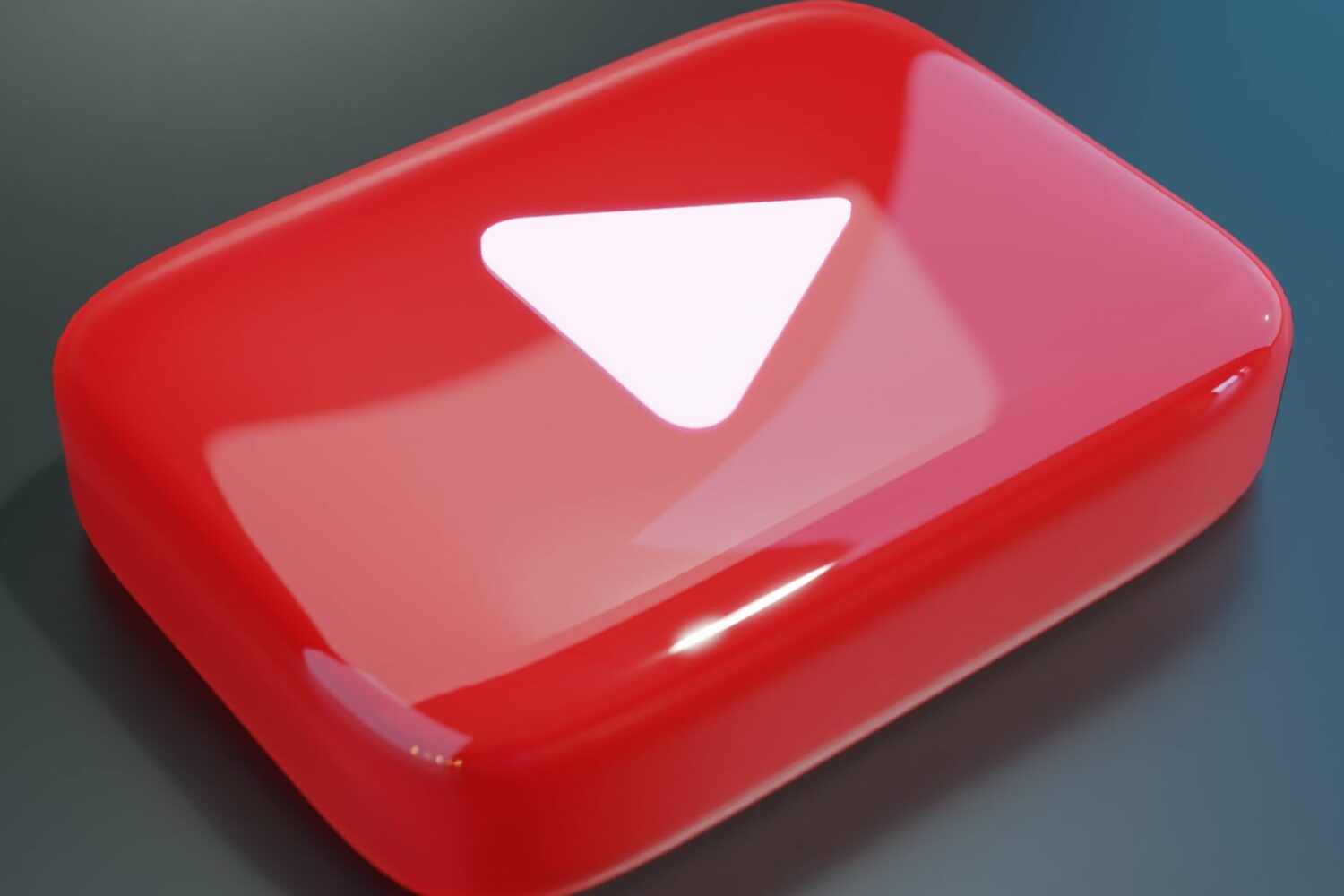Glossy rendering of YouTube's red button with a white Play symbol